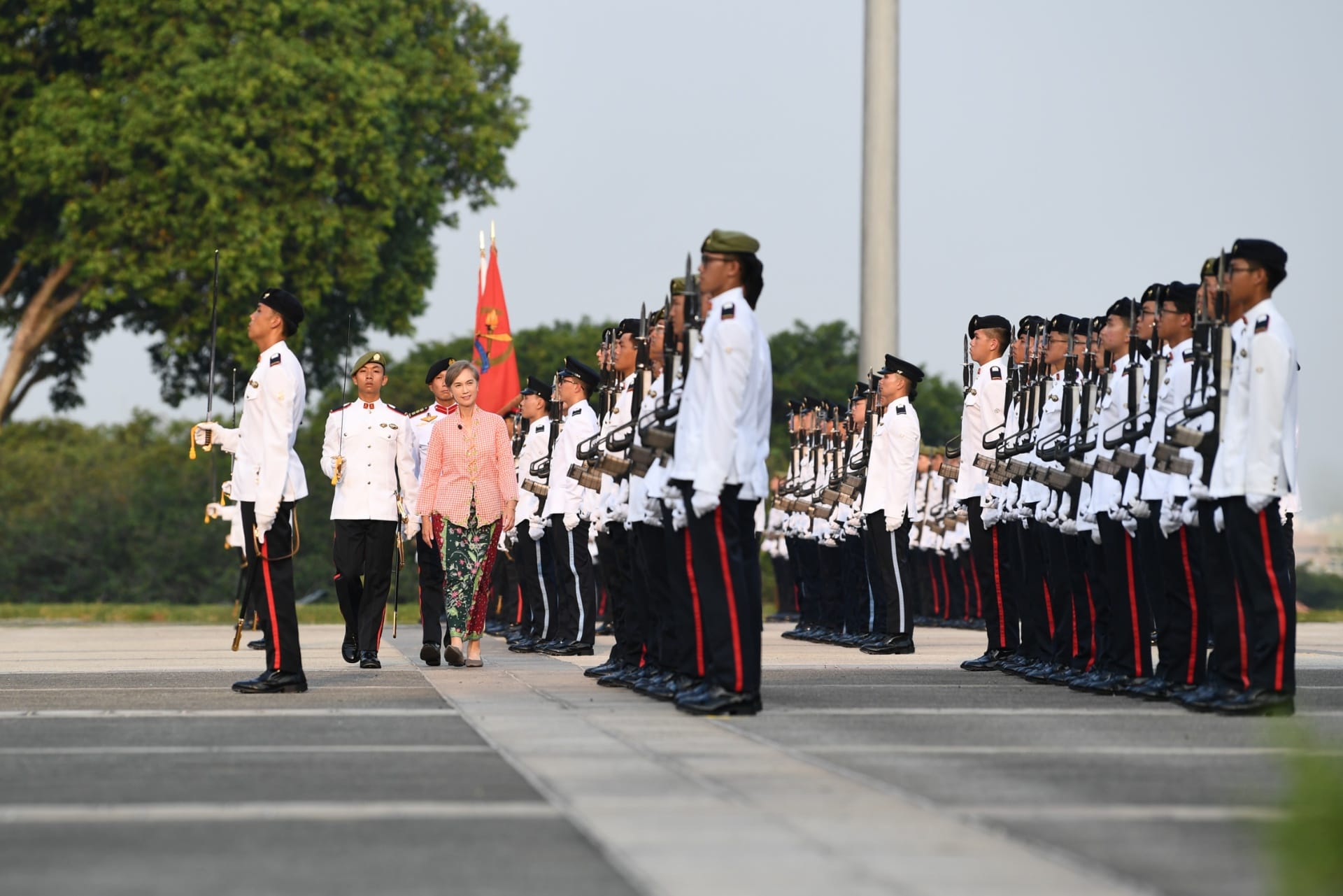 Minister for Digital Development and Information Josephine Teo reviewing the contingents at the 142nd Officer Cadet Commissioning Parade this evening.