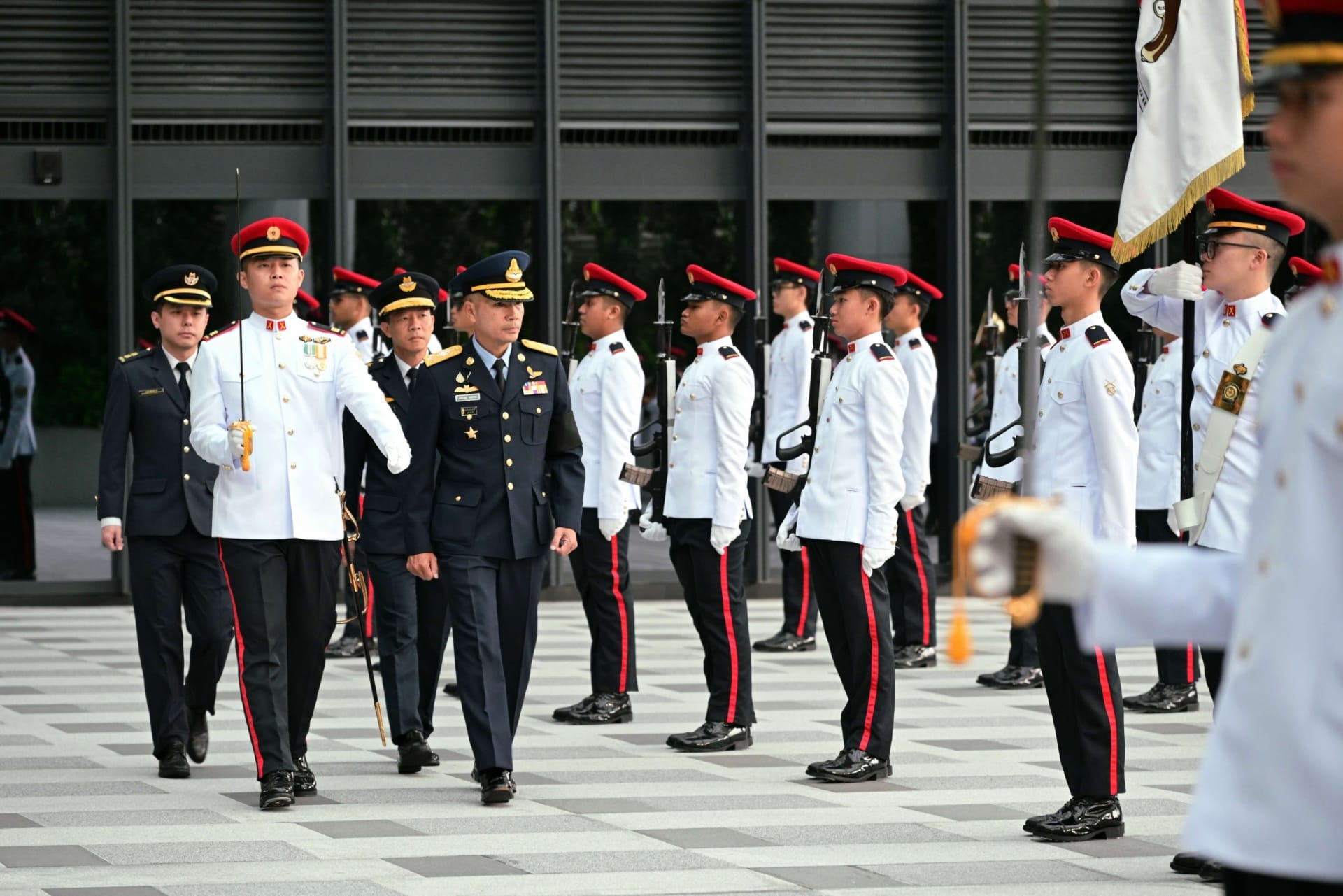 ACM Sakesan inspecting the Guard of Honour at MINDEF.