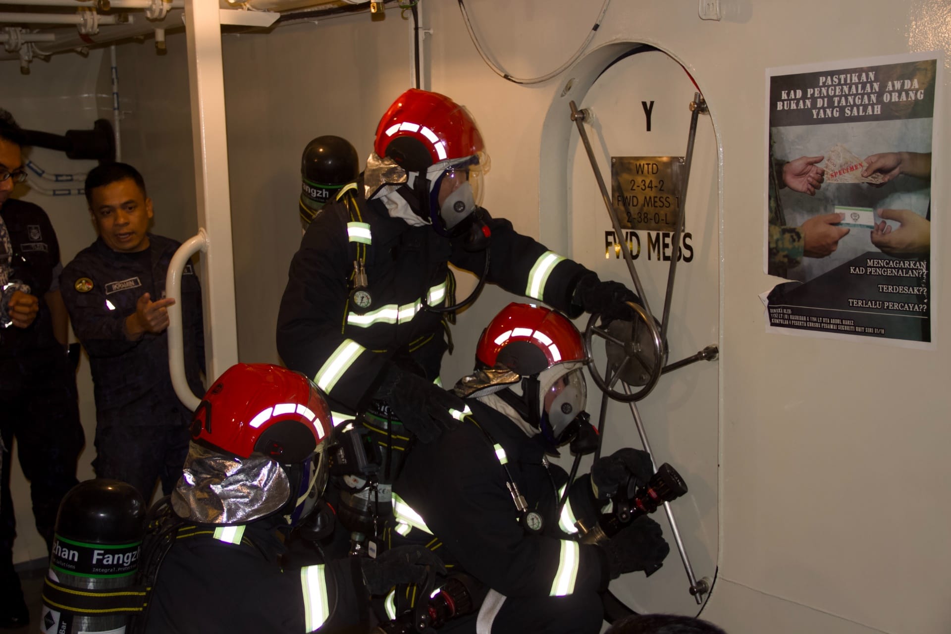 RSN personnel demonstrating the Fire-Fighting and Damage Control procedure as part of the exercise.