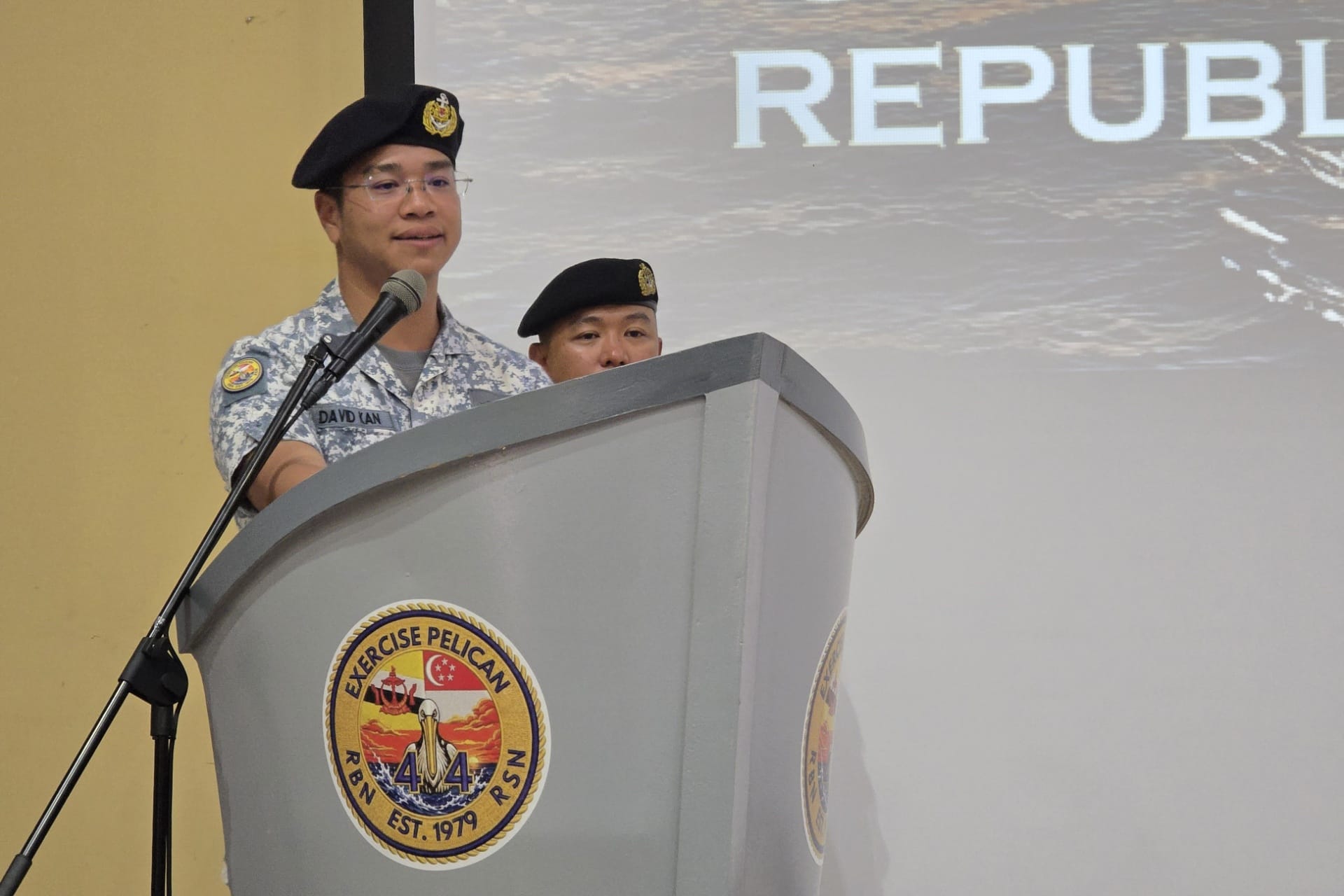 Commander 2nd Flotilla and Commander Task Group for Exercise Pelican 2026 Colonel Kan Shengyao David delivering his address at the closing ceremony of Exercise Pelican.