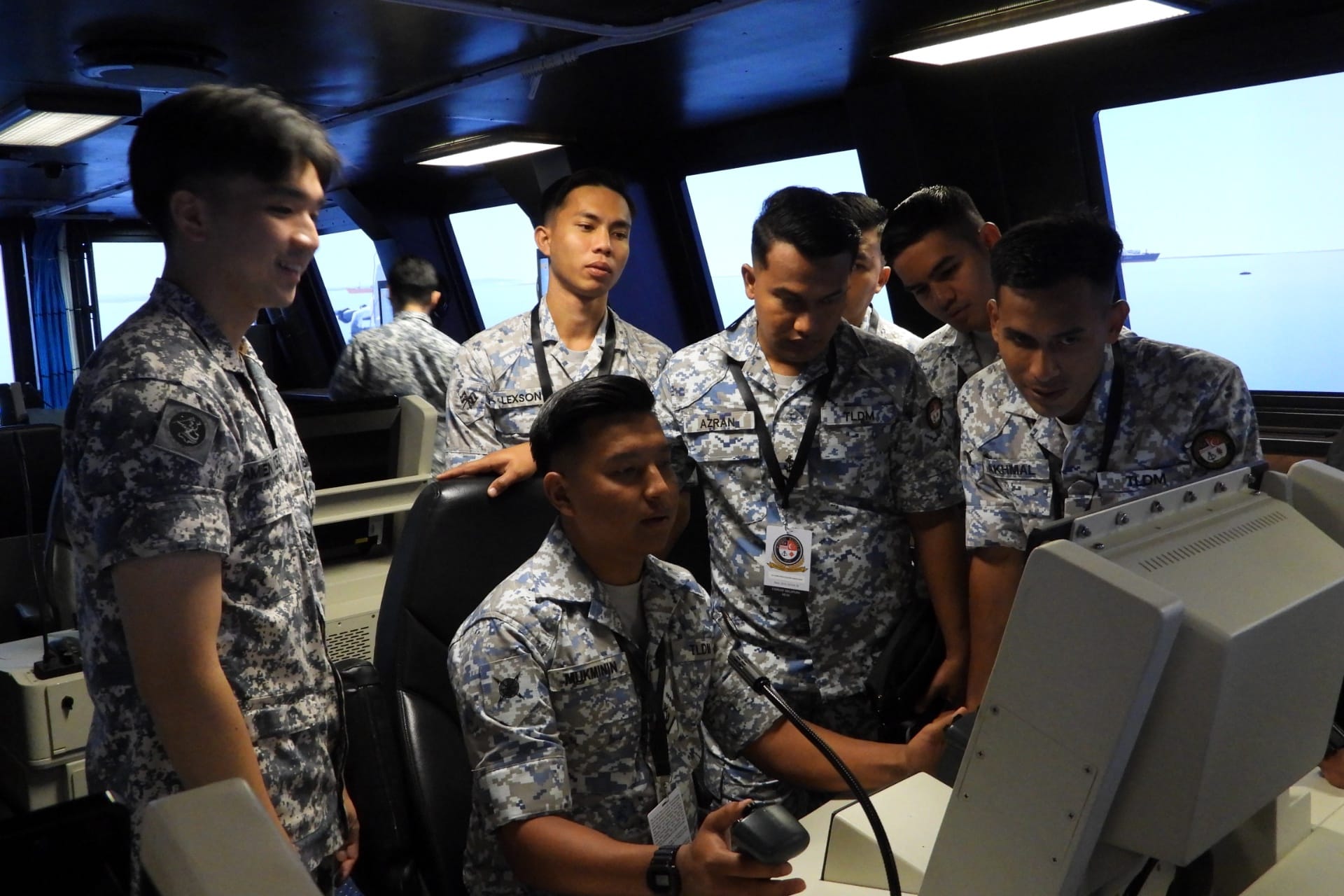 RMN personnel gaining hands-on experience at the Weapon System Console during a visit to the Littoral Mission Vessel (LMV) Simulation Centre (SIMCEN).