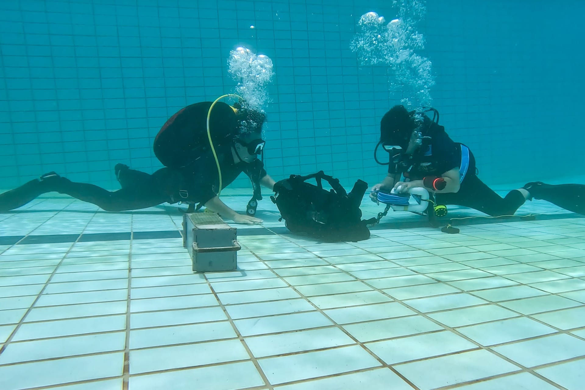 Personnel from the Republic of Singapore Navy (RSN) and the Royal Brunei Navy (RBN) carrying out Maritime Explosive Ordnance Disposal response procedures during Exercise Pelican.