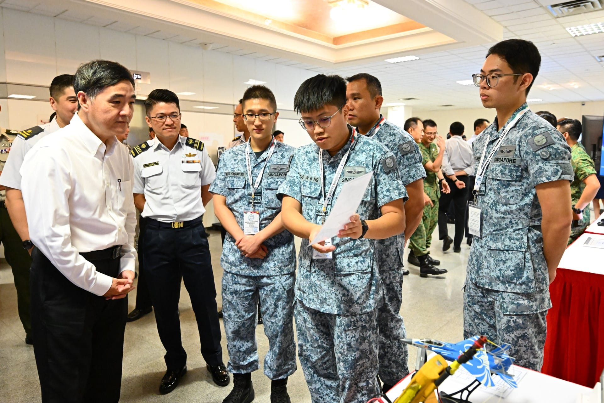 Mr Heng viewing a chart from the Landing Gear System Digital Data Analysis Kit by 817 Squadron.