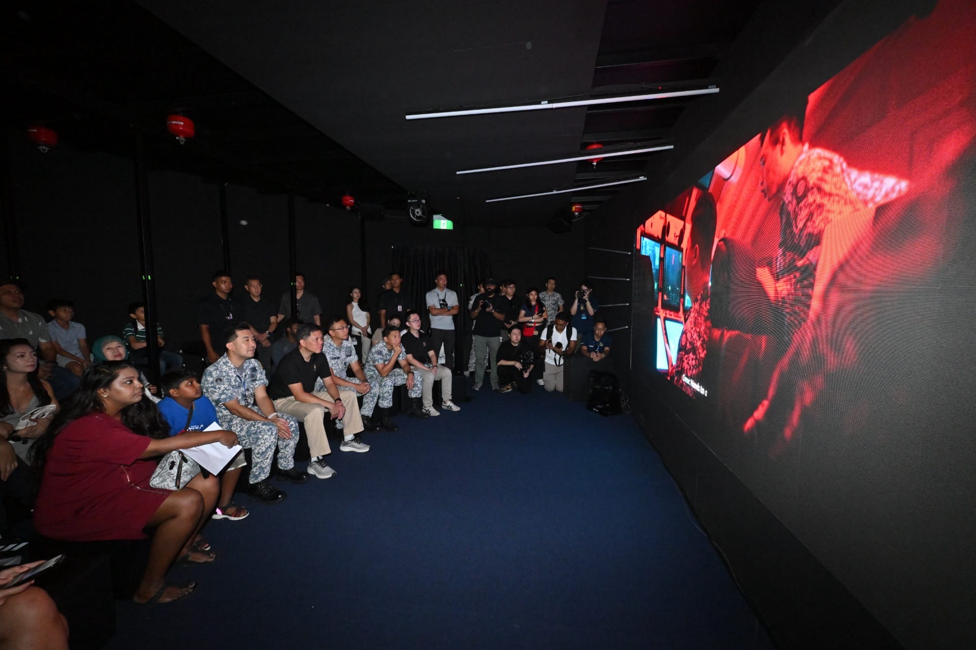 Mr Chan viewing the short film featuring the Republic of Singapore Navy submarines in the Immersive Theatre at Navy@Vivo.