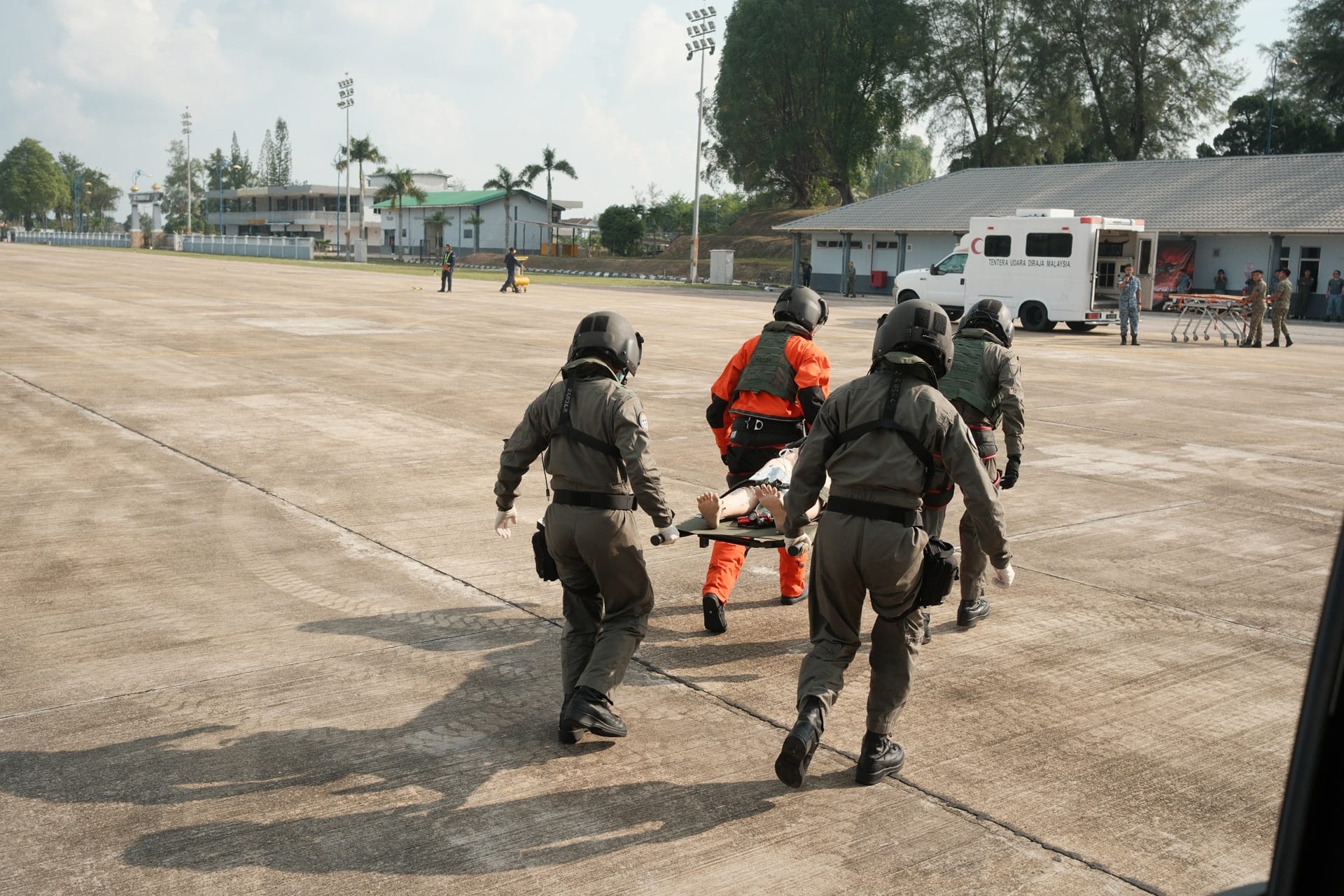 RSAF medical crew transferring a simulated casualty for onward medical care.