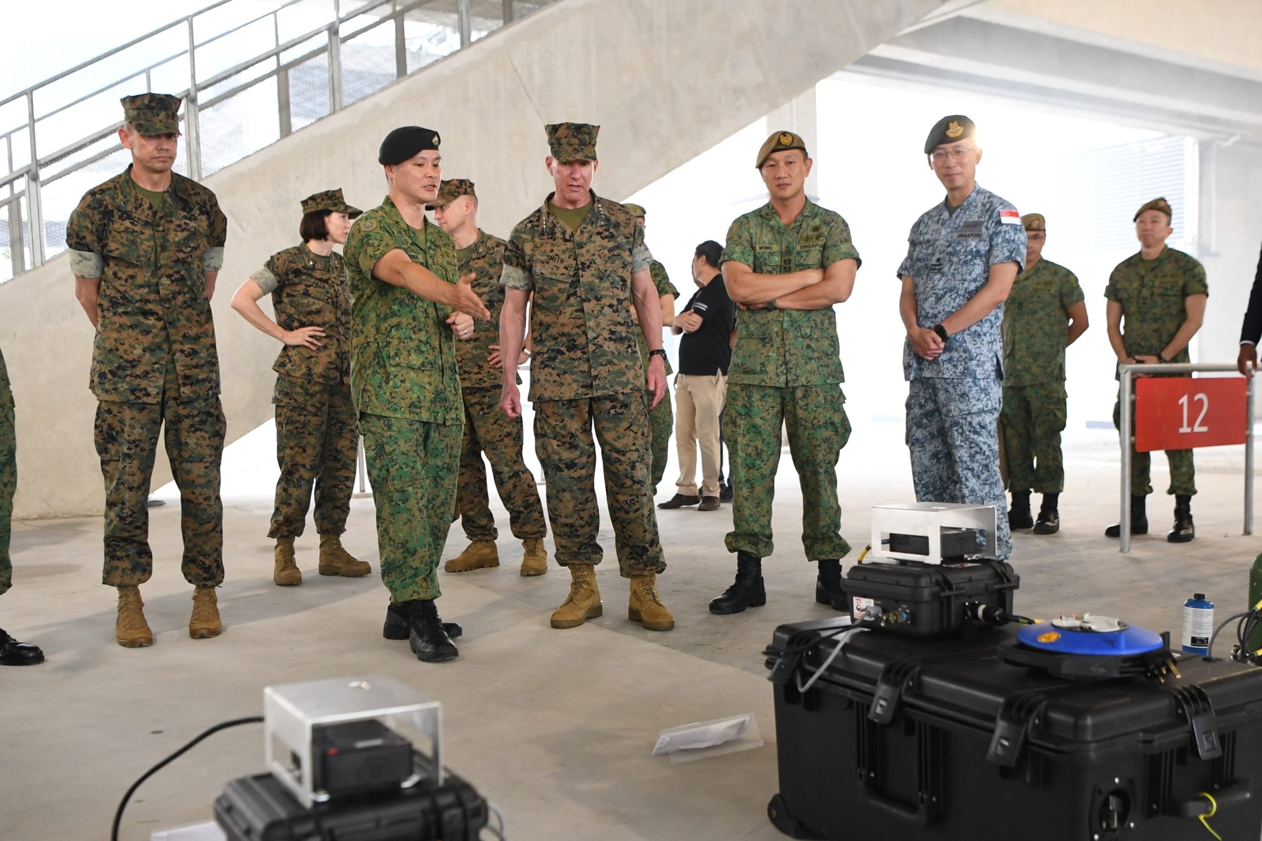GEN Smith (centre-left) visited SAFTI City and received a brief on the training facility. He was also shown how technology was employed to enhance training realism for our soldiers.