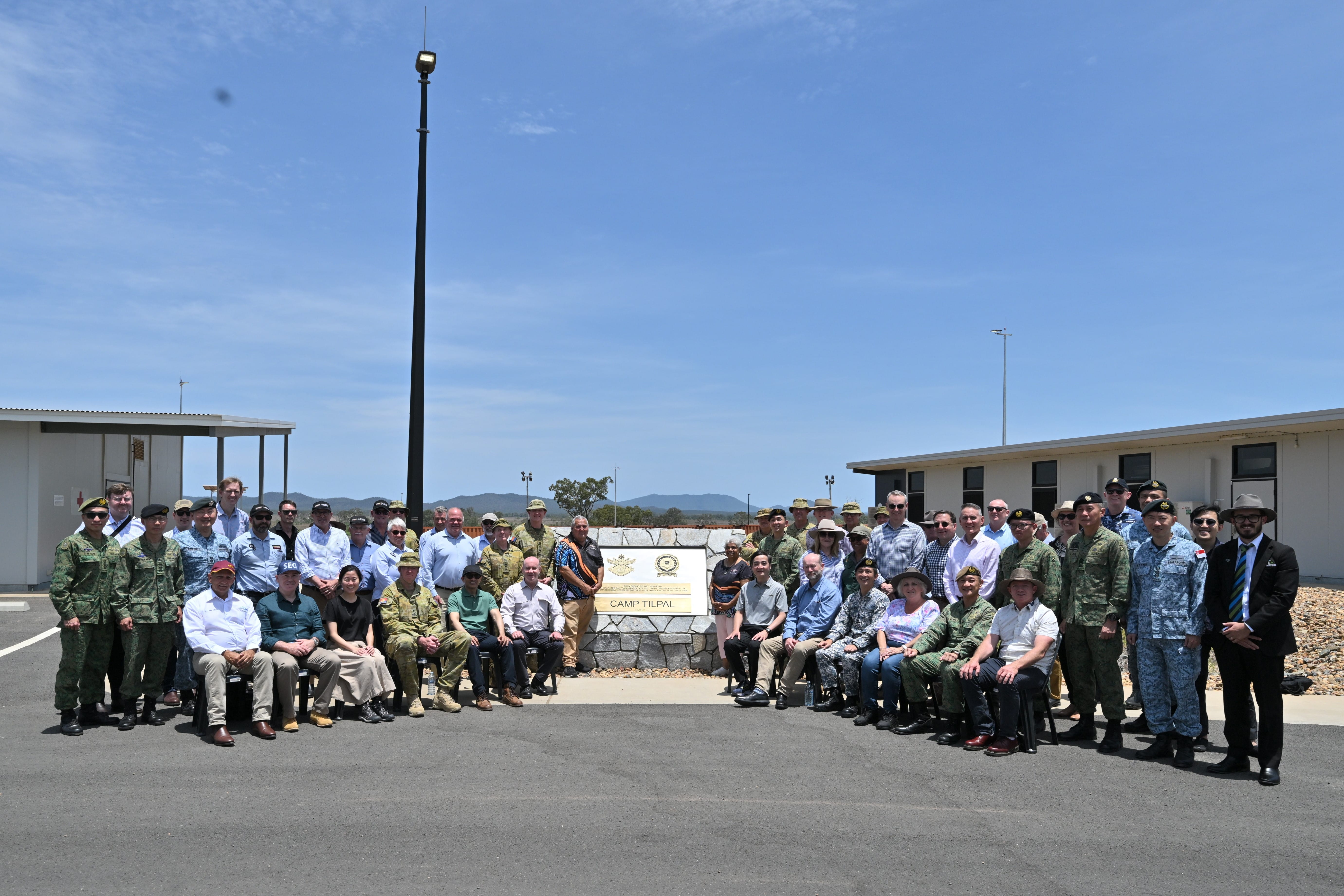 Group photo with Mr Heng Chee How and Mr Greg Moriarity at the commemorative plinth in Camp Tilpal.