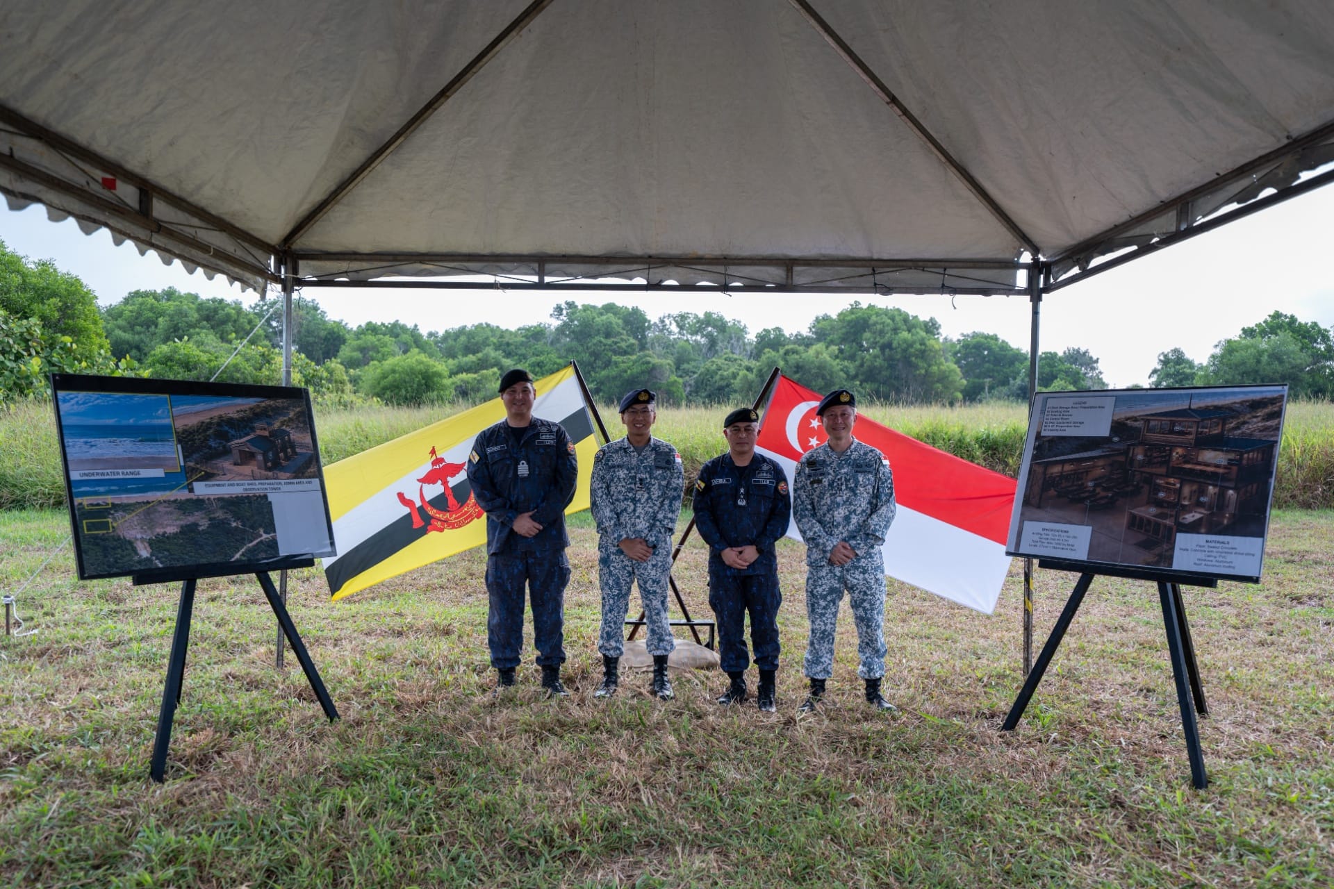 Chief of Navy Rear Admiral Sean Wat (second from left) and Commander RBN First Admiral Sahibul Bahari bin Haji Zainal Abidin (second from right) joining RSN and RBN personnel at the inaugural Underwater Demolition Range Demonstration.