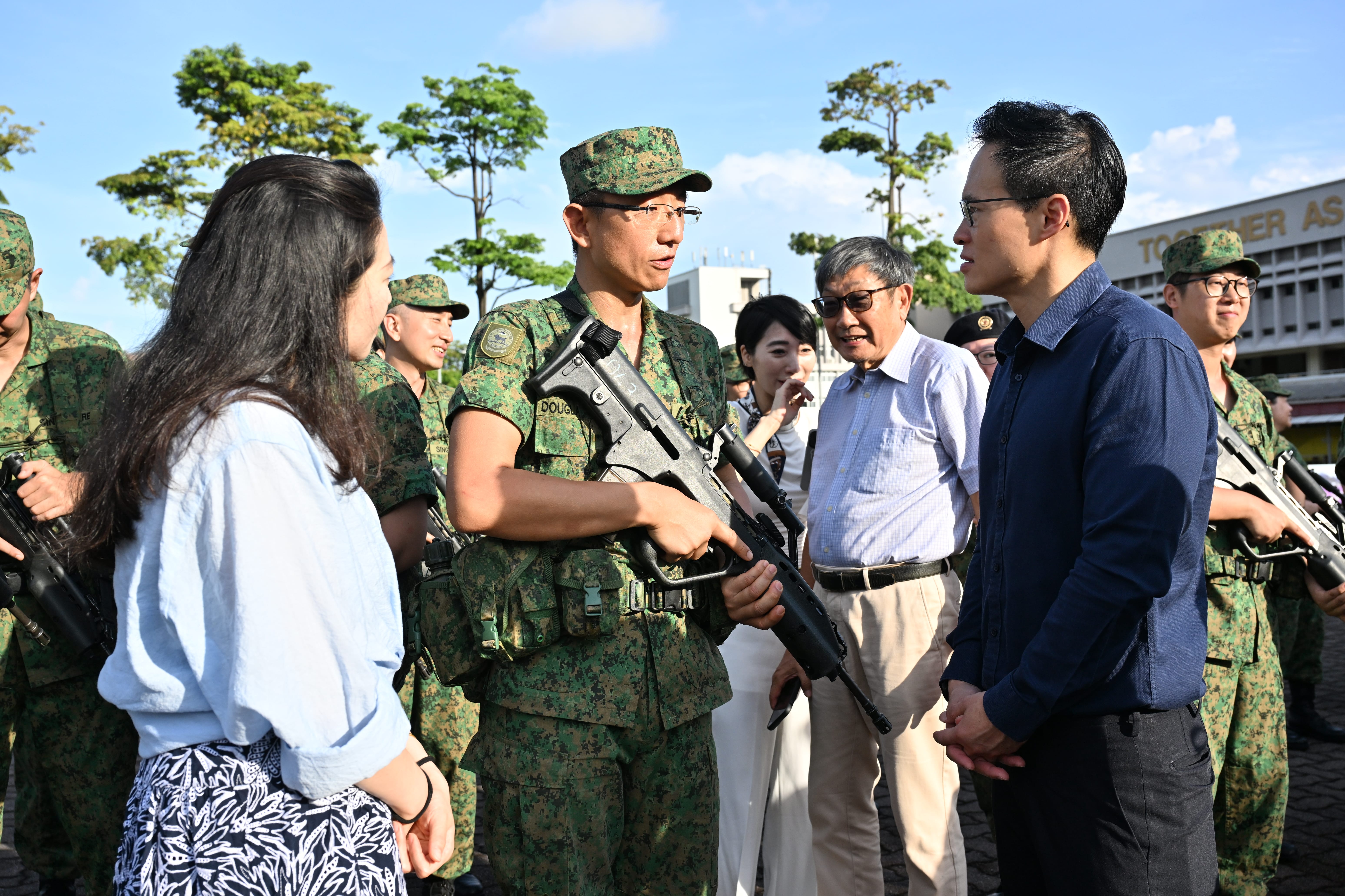 MOS Choo interacting with Milestone Parade participants and guests.