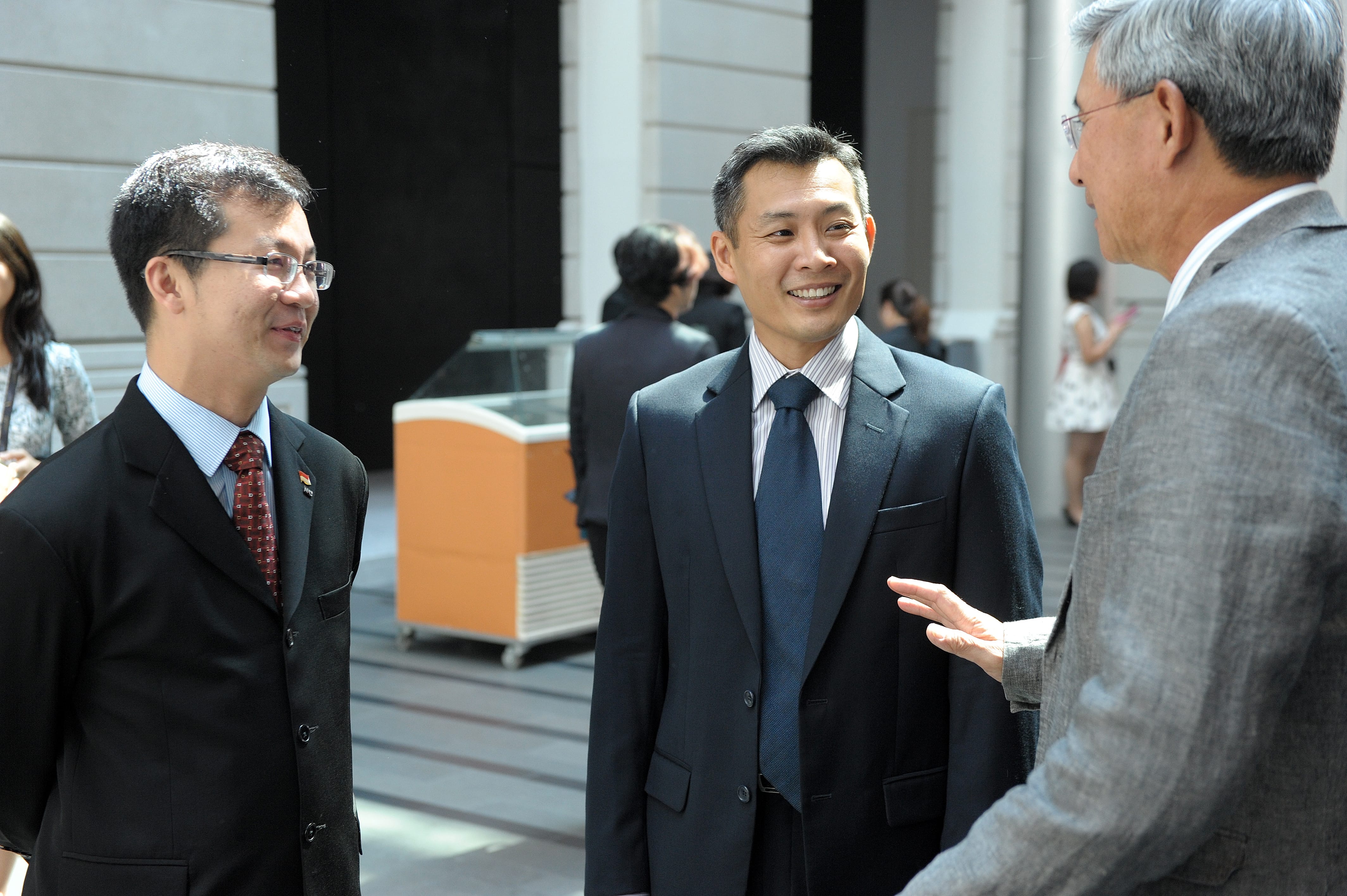 Men in suits talking to each other
