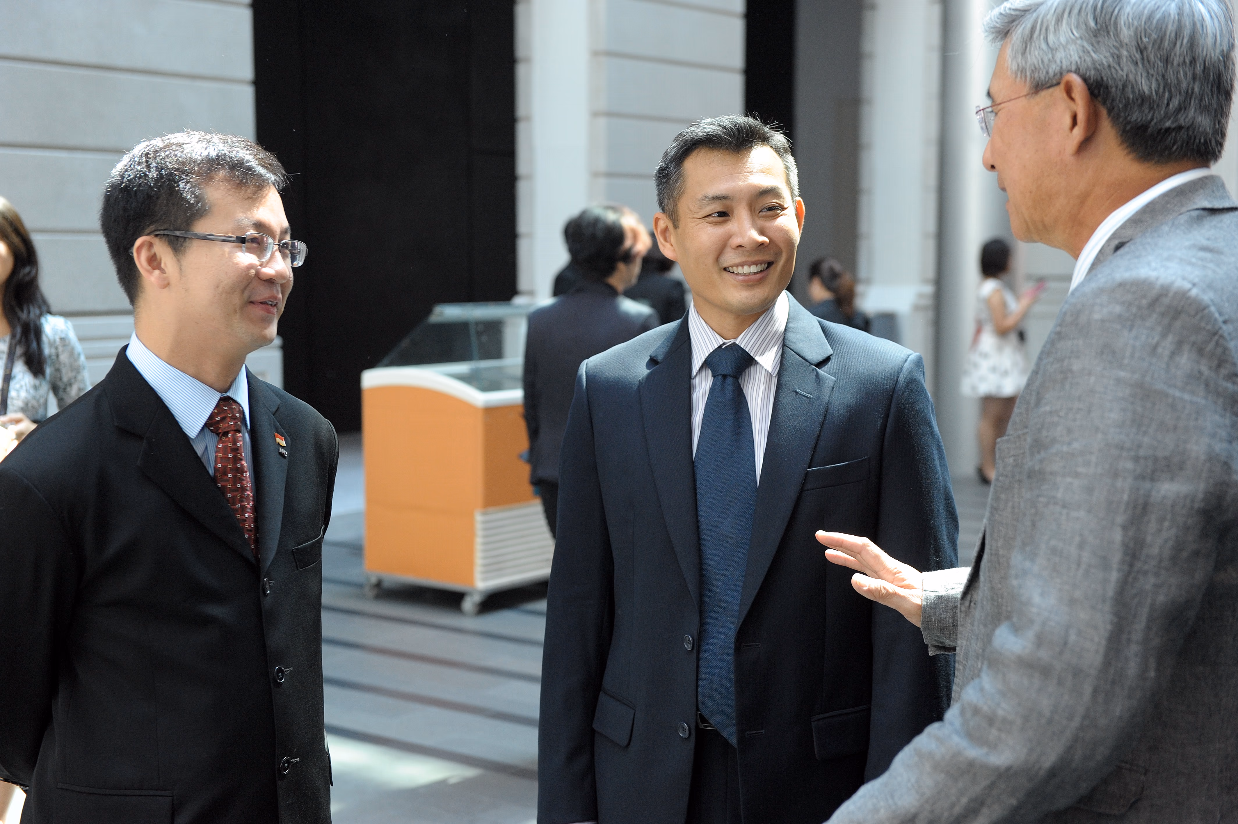 Men in suits talking to each other