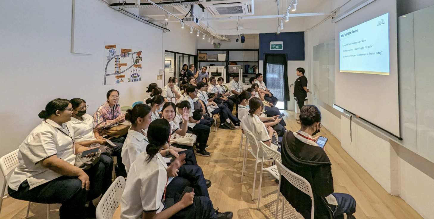 Classroom setting: Students attending a presentation in rows of chairs