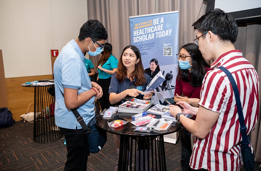 People at a healthcare scholarship fair