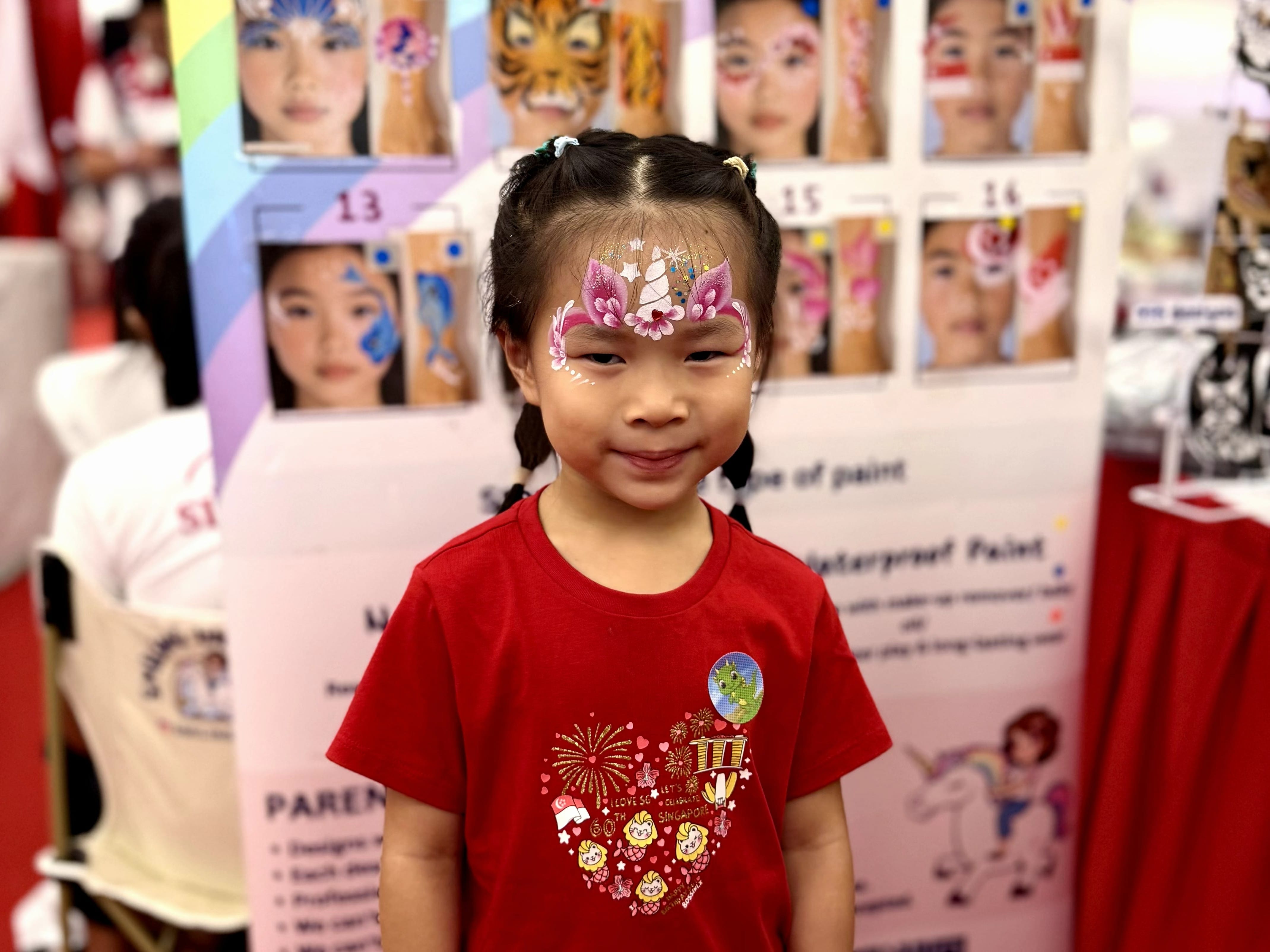 Girl with face paint smiling