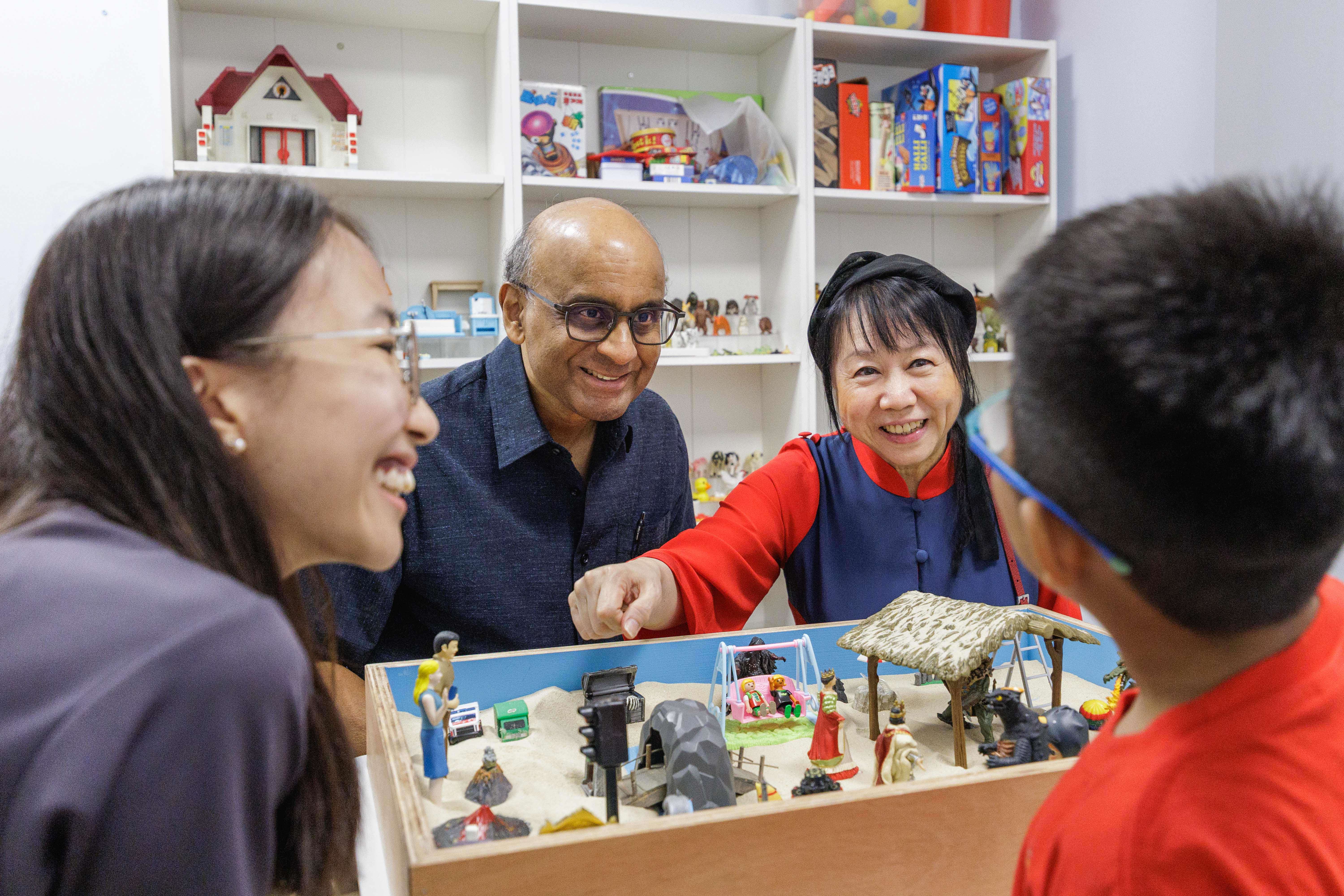 Mr & Mrs Tharman engaging beneficiary at REACH's Project GEMinate 