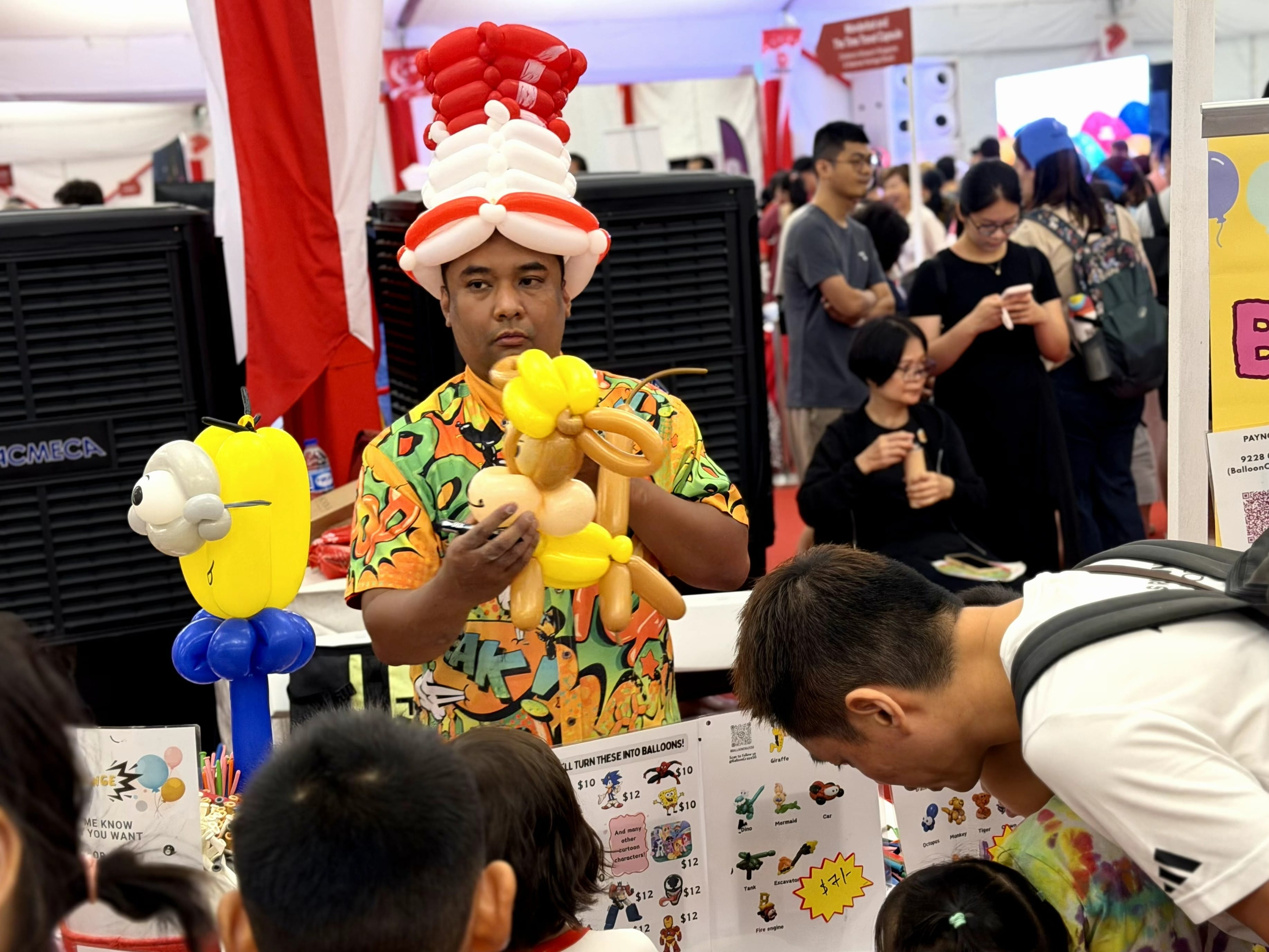 Man creating a balloon sculpture