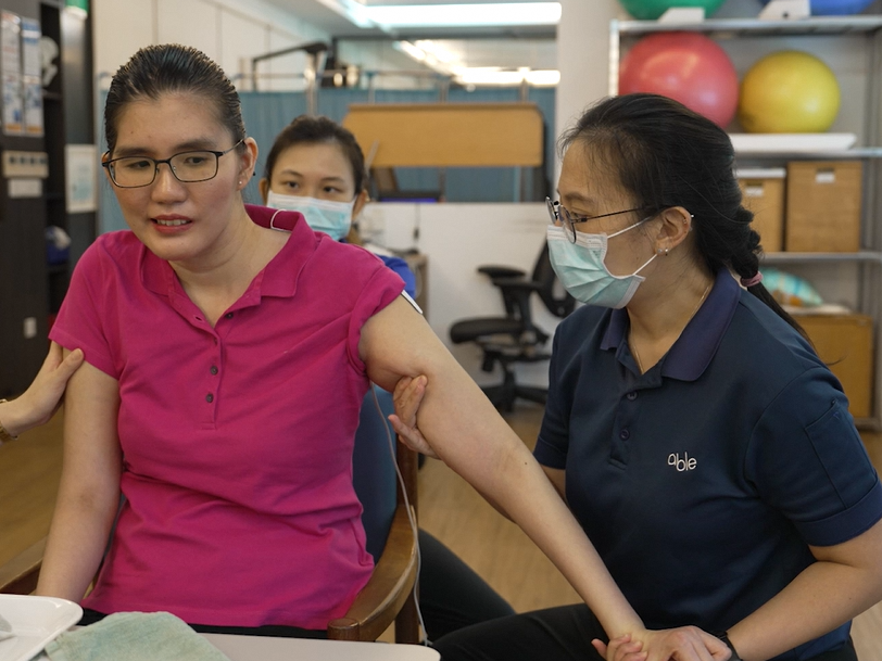 Able therapist doing rehab exercises with Jessica