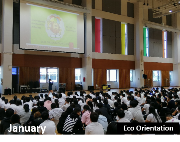 Auditorium view with a presenter speaking before a large audience.