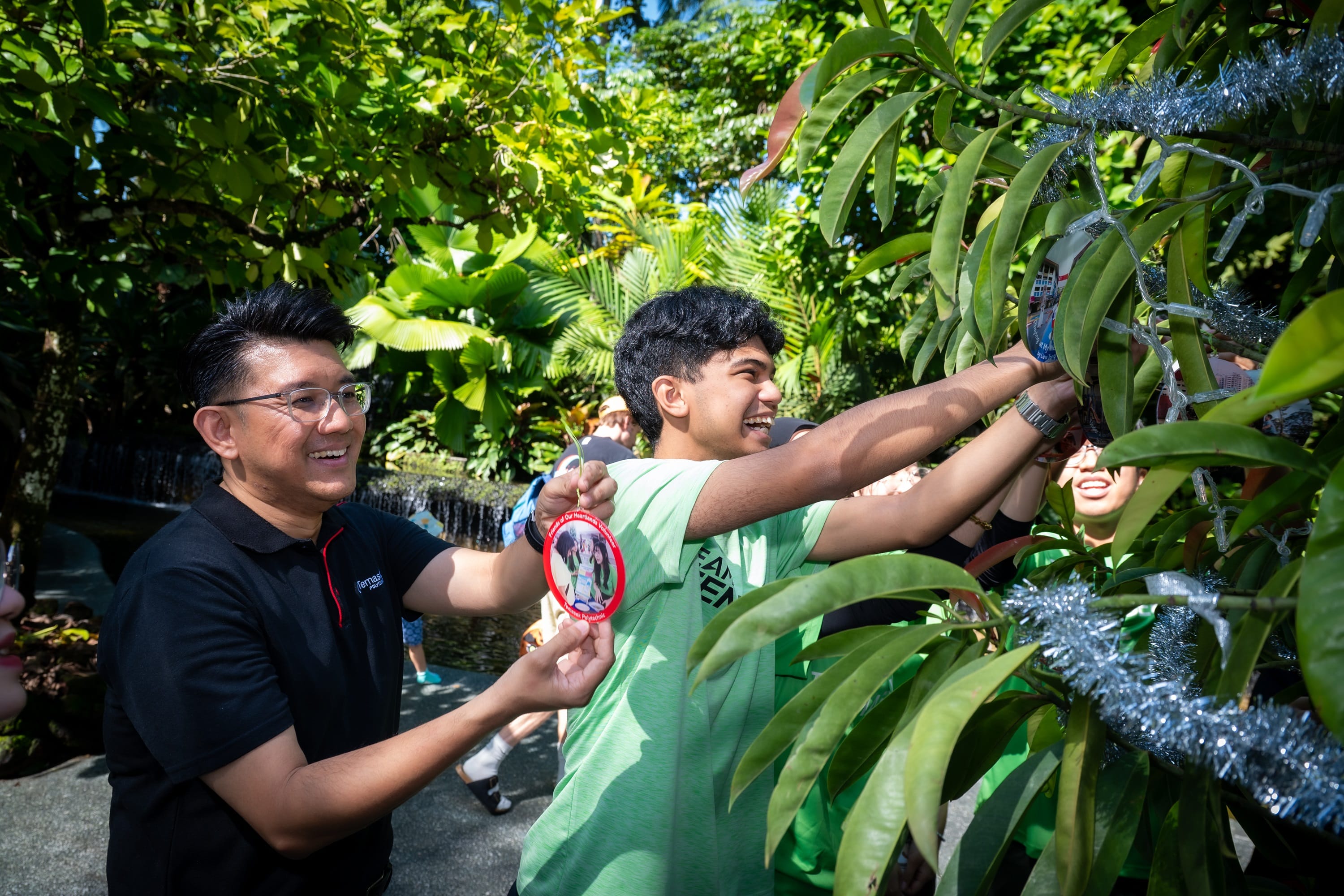 Members of public decorating trees.