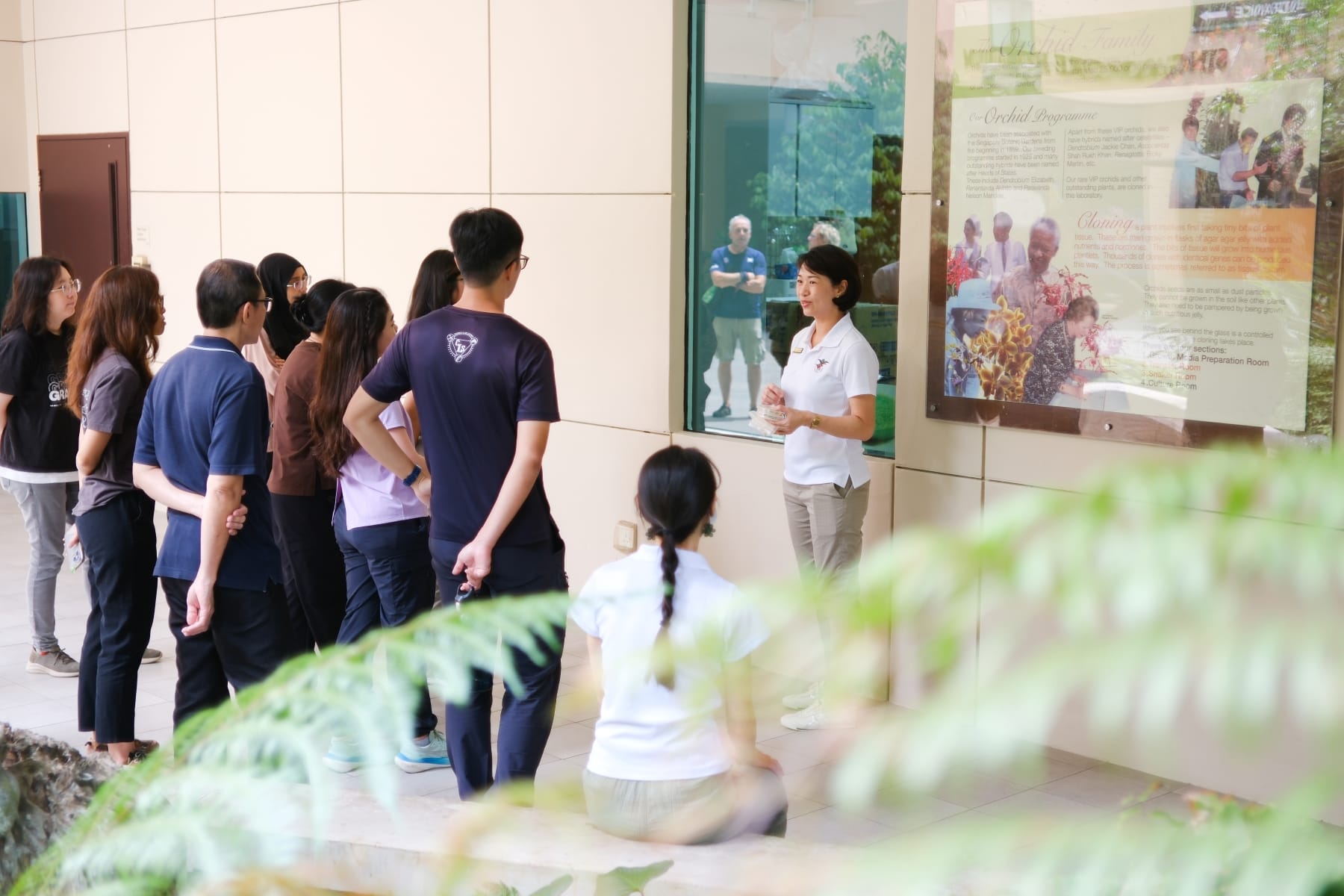 Dr Gillian Khew, Centre Director for Plant Molecular Biology, Tissue Culture and Seed Bank, explaining key laboratory functions to visitors outside the Media Preparation Room