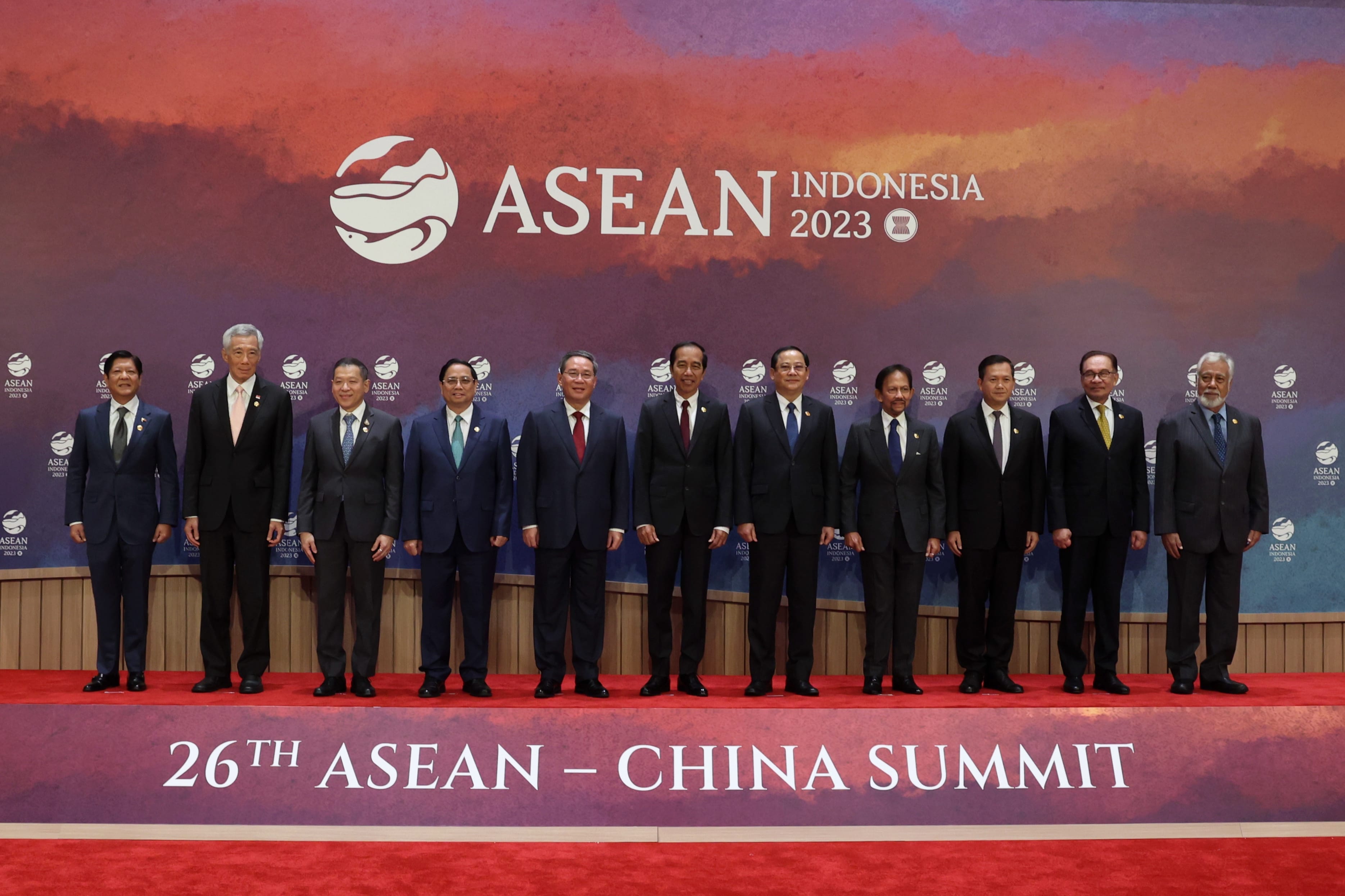 Group of formally dressed leaders pose at the 26th ASEAN-China Summit. Backdrop shows the ASEAN Indonesia 2023 logo.
