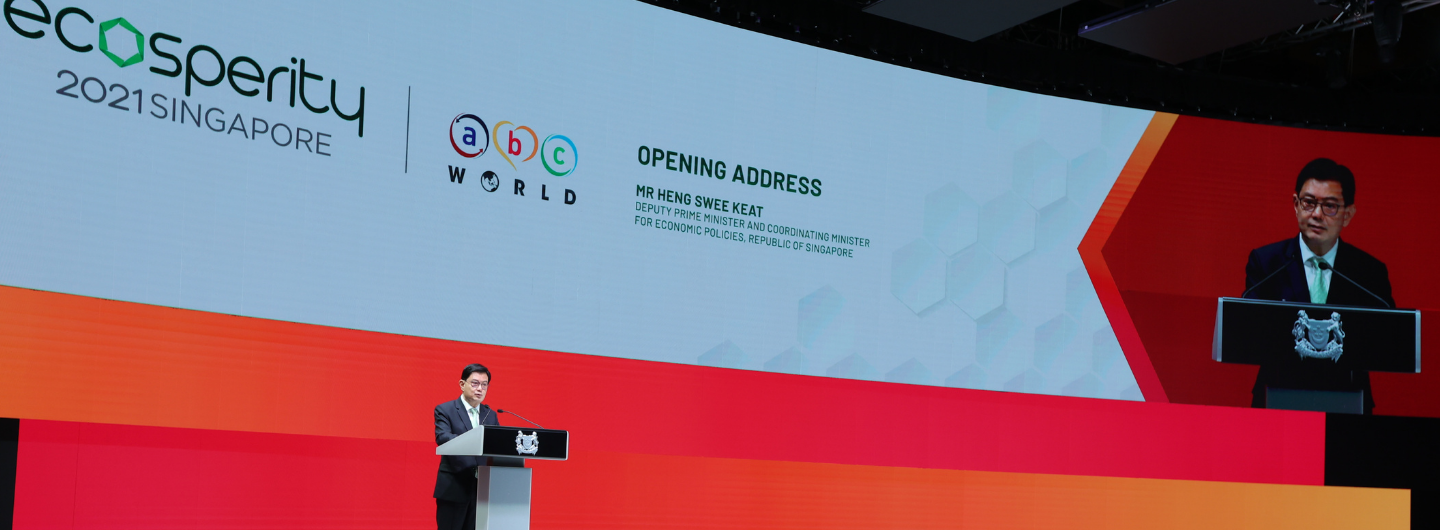 Heng Swee Keat speaking at Ecosperity 2021 conference on stage with large screen.