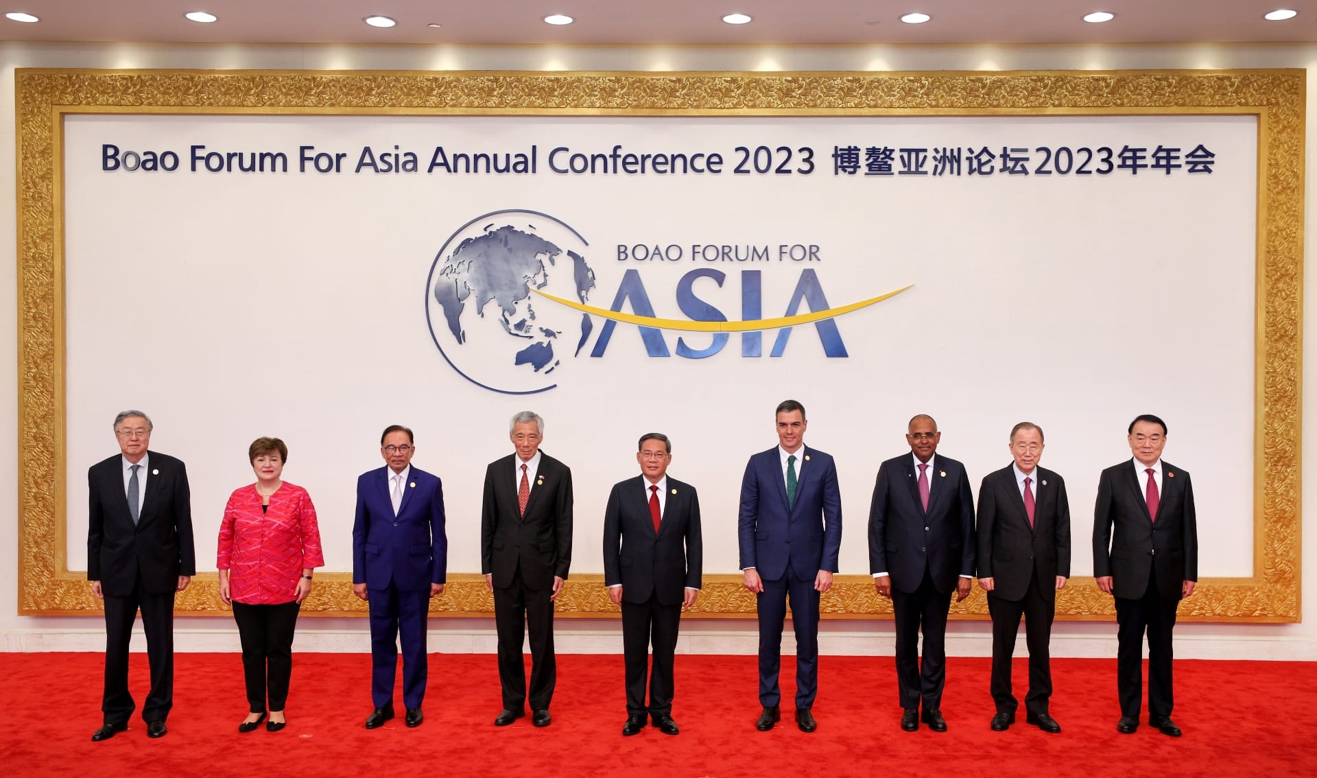 Group of leaders at Boao Forum For Asia Annual Conference 2023 on a red carpet.