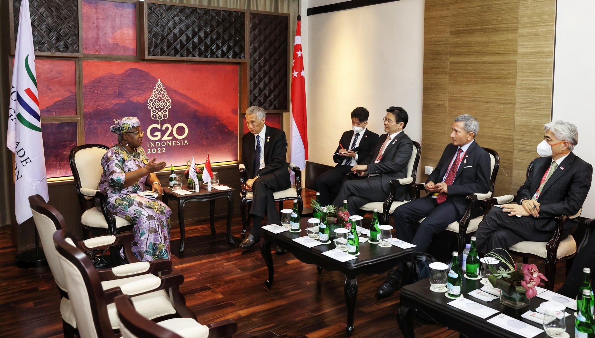 Group of people seated, in discussion during the G20 Indonesia 2022 event.