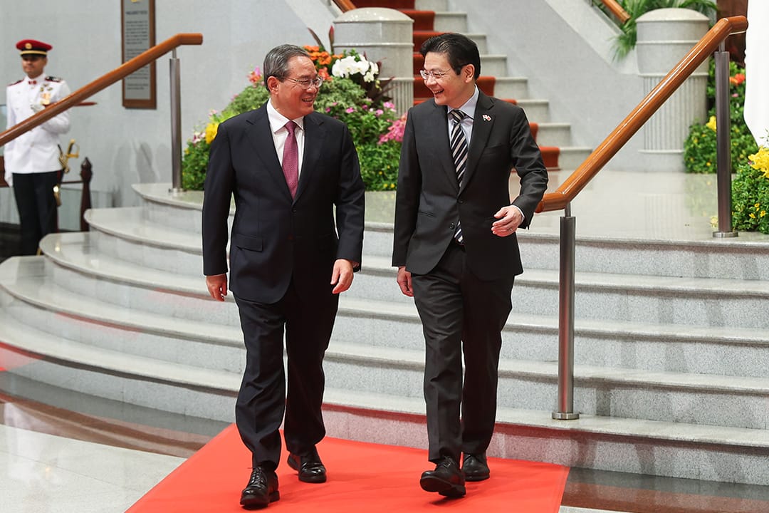 Photo of PM Lawrence Wong walking with People’s Republic of China Premier Li Qiang