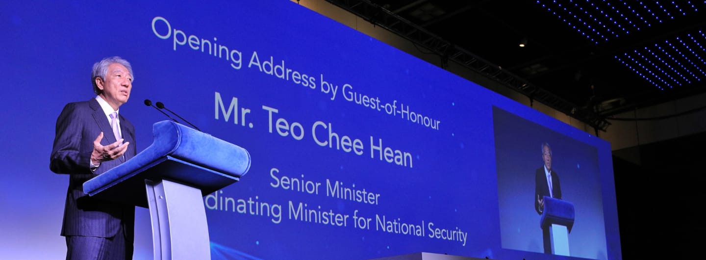 Mr. Teo Chee Hean at podium; large screen says "Opening Address by Guest-of-Honour".