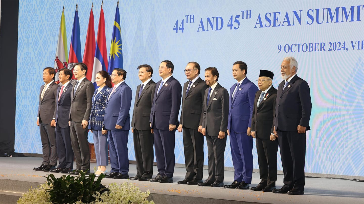 ASEAN leaders stand in a line before flags and "44th and 45th ASEAN Summit, 9 October 2024".