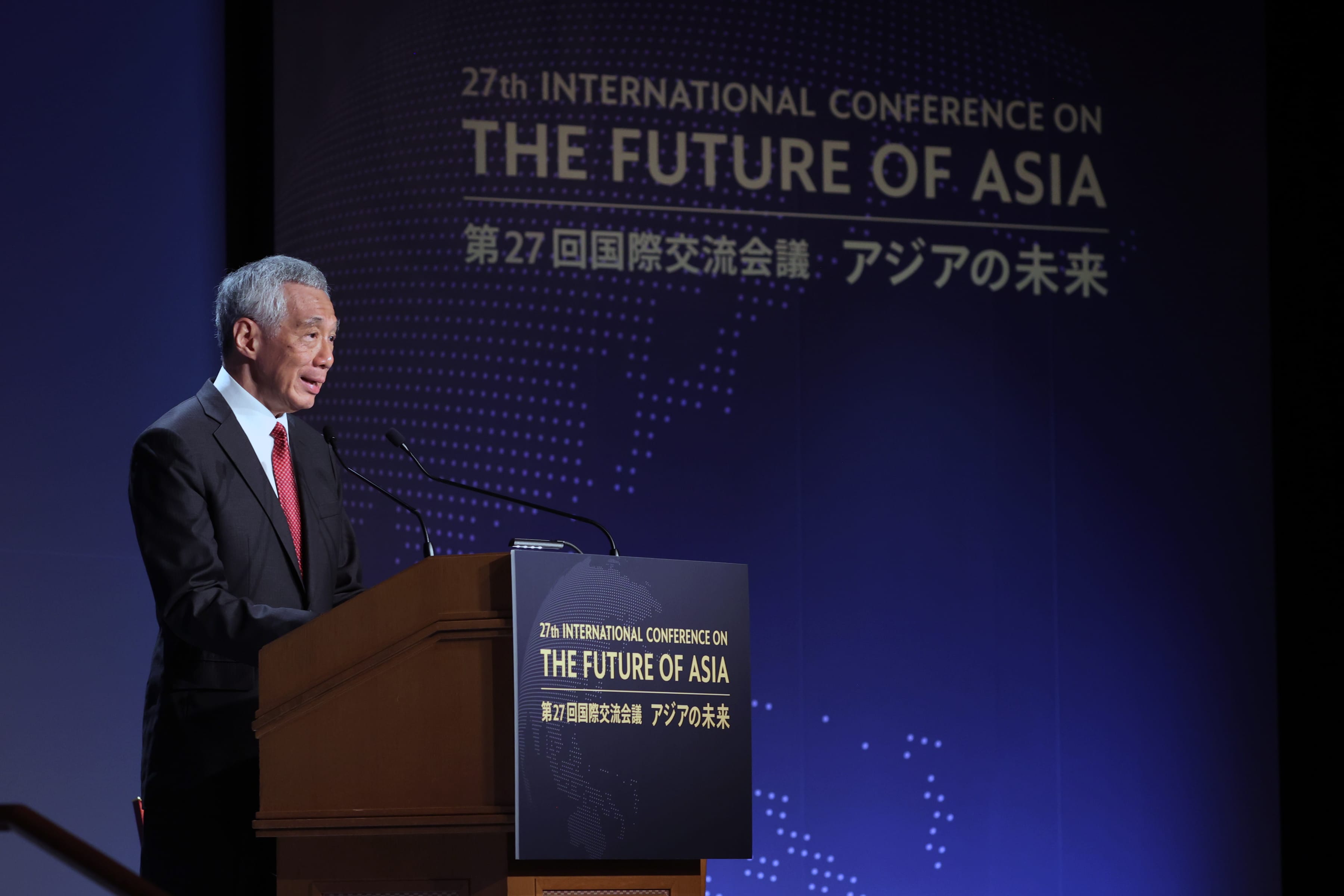 Lee Hsien Loong at podium, "27th International Conference on the Future of Asia" displayed behind.