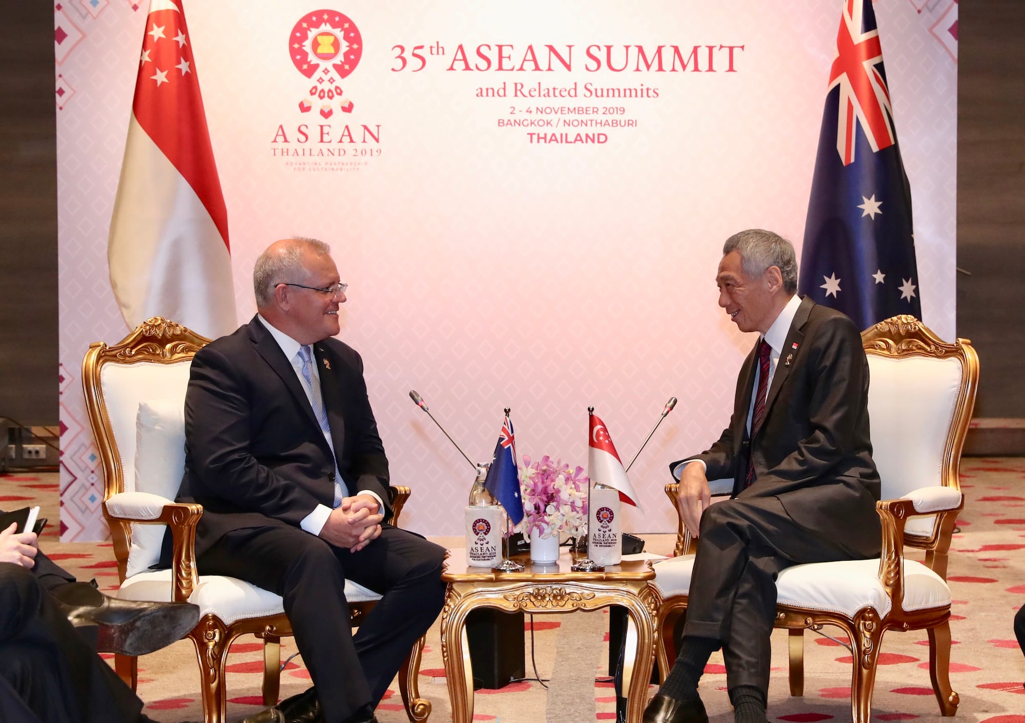 Scott Morrison and Lee Hsien Loong seated facing each other at the 35th ASEAN Summit.