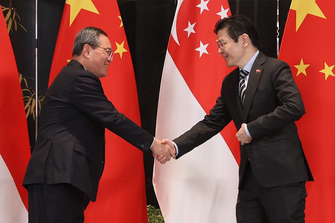 Photo of PM Lawrence Wong shaking hands with People’s Republic of China Premier Li Qiang