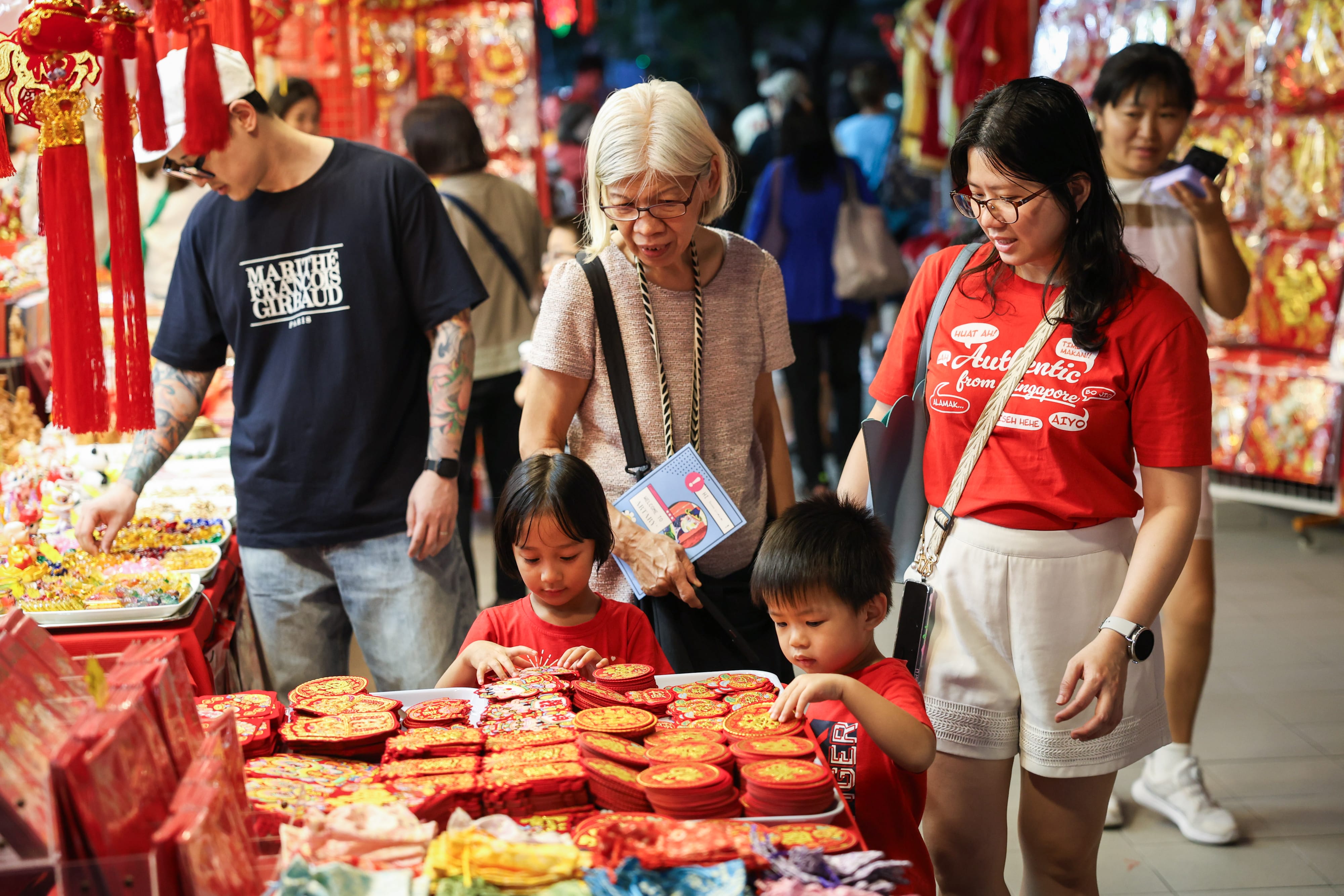 Photo of family shopping for Chinese New Year decorations at Chinatown.