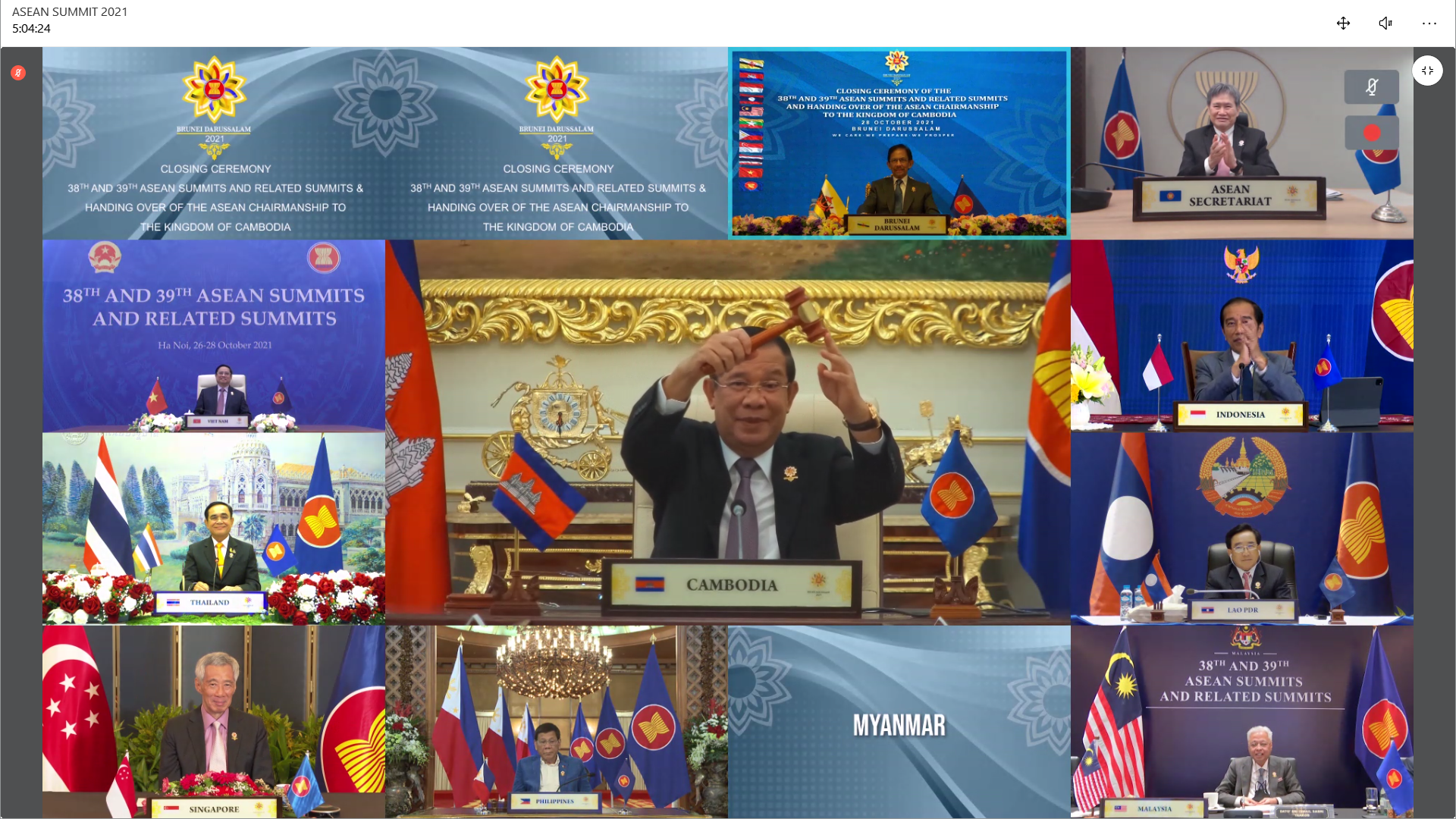 Video conference screen showing ASEAN summit participants with flags, logos, and country names.