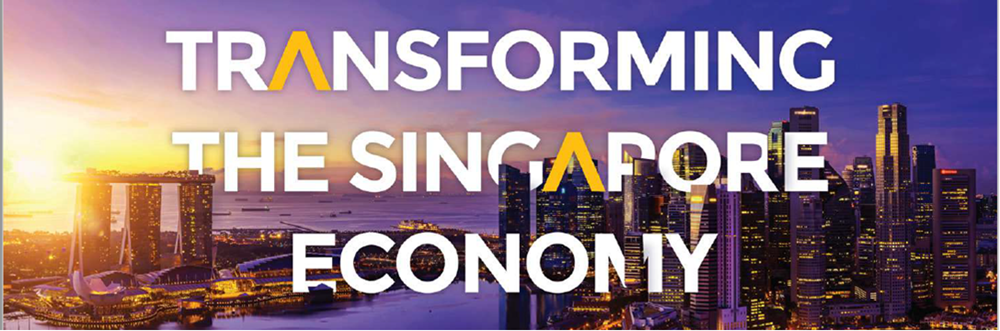 Text, Transforming the Singapore Economy over Marina Bay Sands and city skyline at sunset.