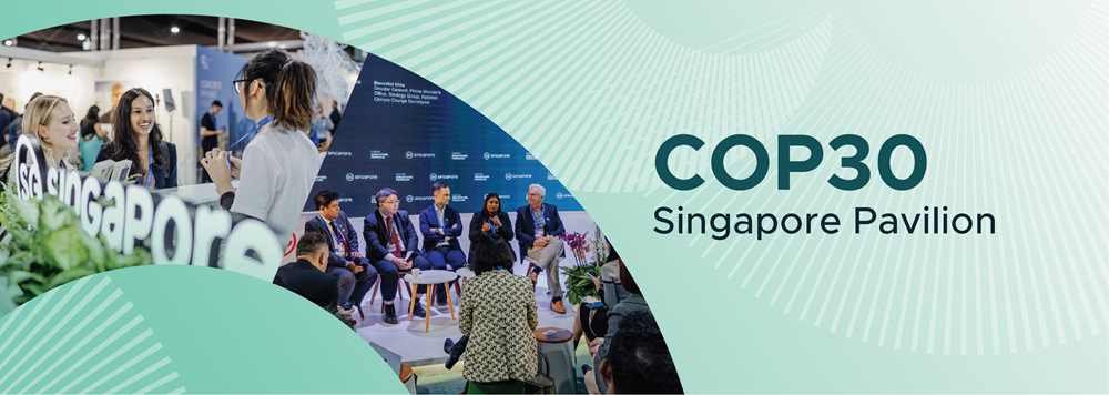 People at Singapore Pavilion panel and booth at an international event.