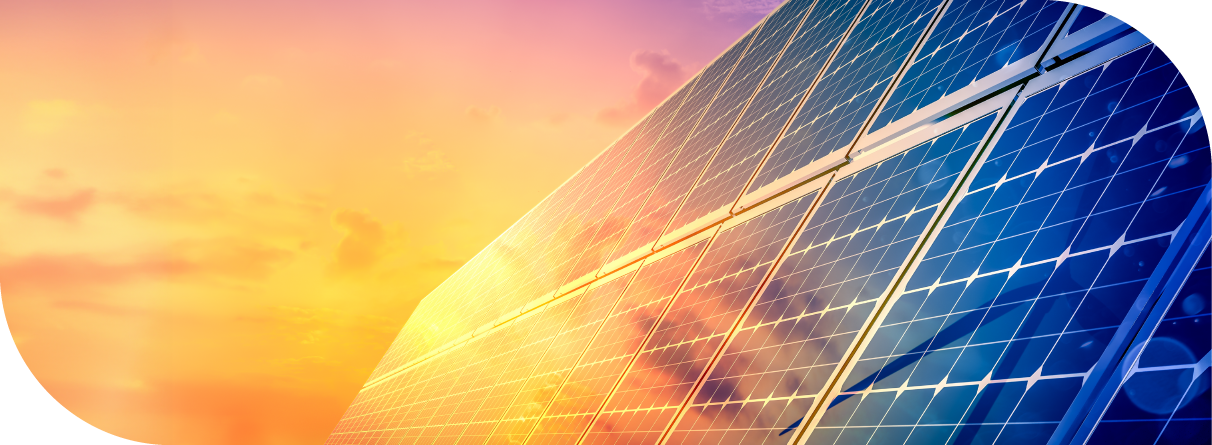 Solar panels against a golden sky.