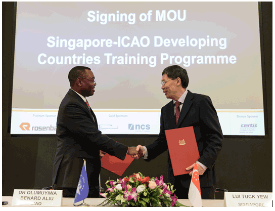 Officials sign an MoU
