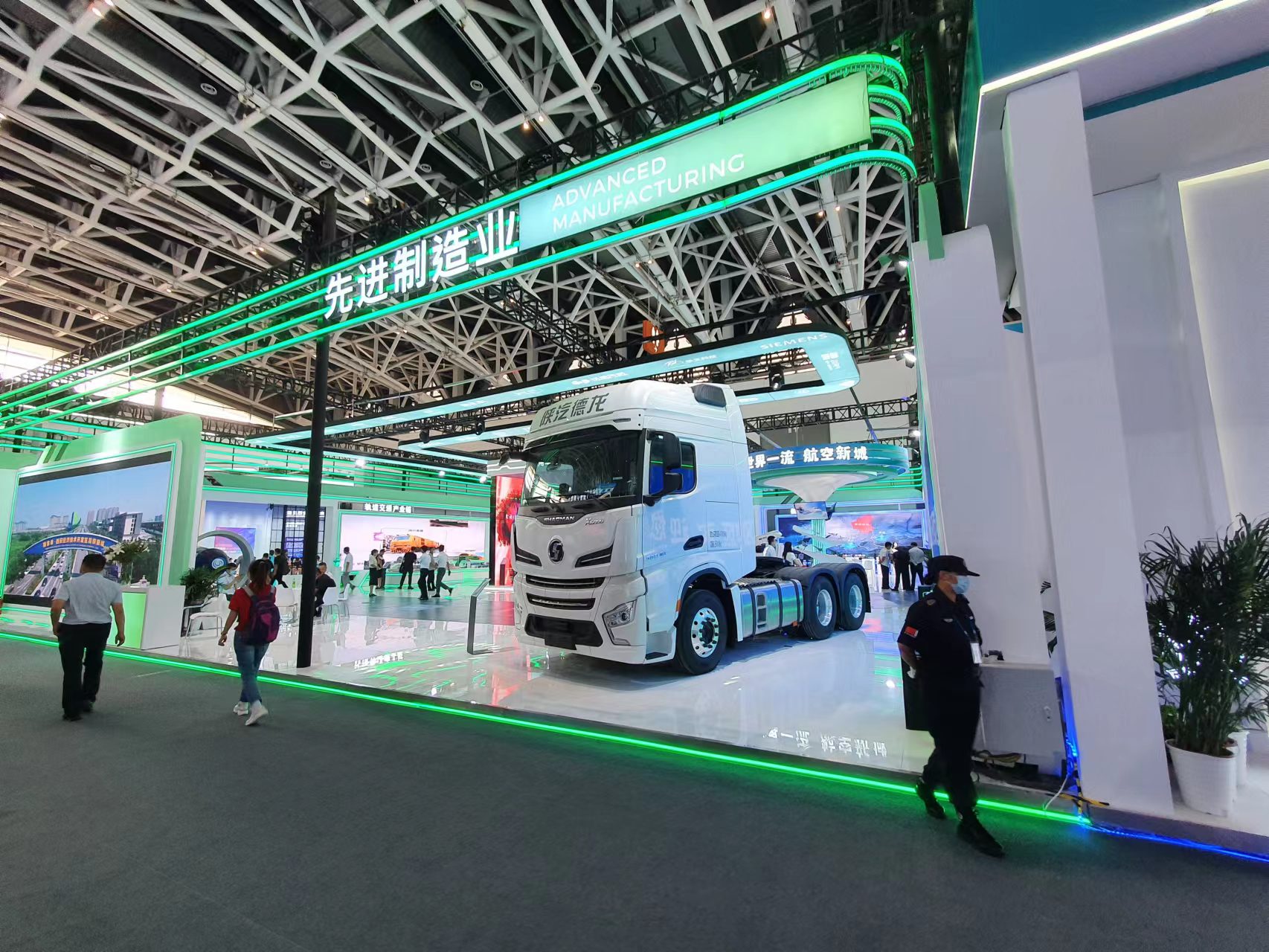 Four people seated in an office setting with a "Singapore-Sichuan Hi-Tech Innovation Park" sign.