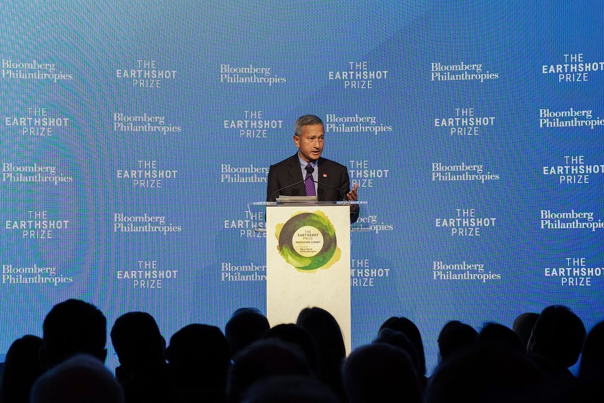 Halimah Yacob at podium with Earthshot Prize logo, addressing a crowd. Bloomberg Philanthropies backdrop.