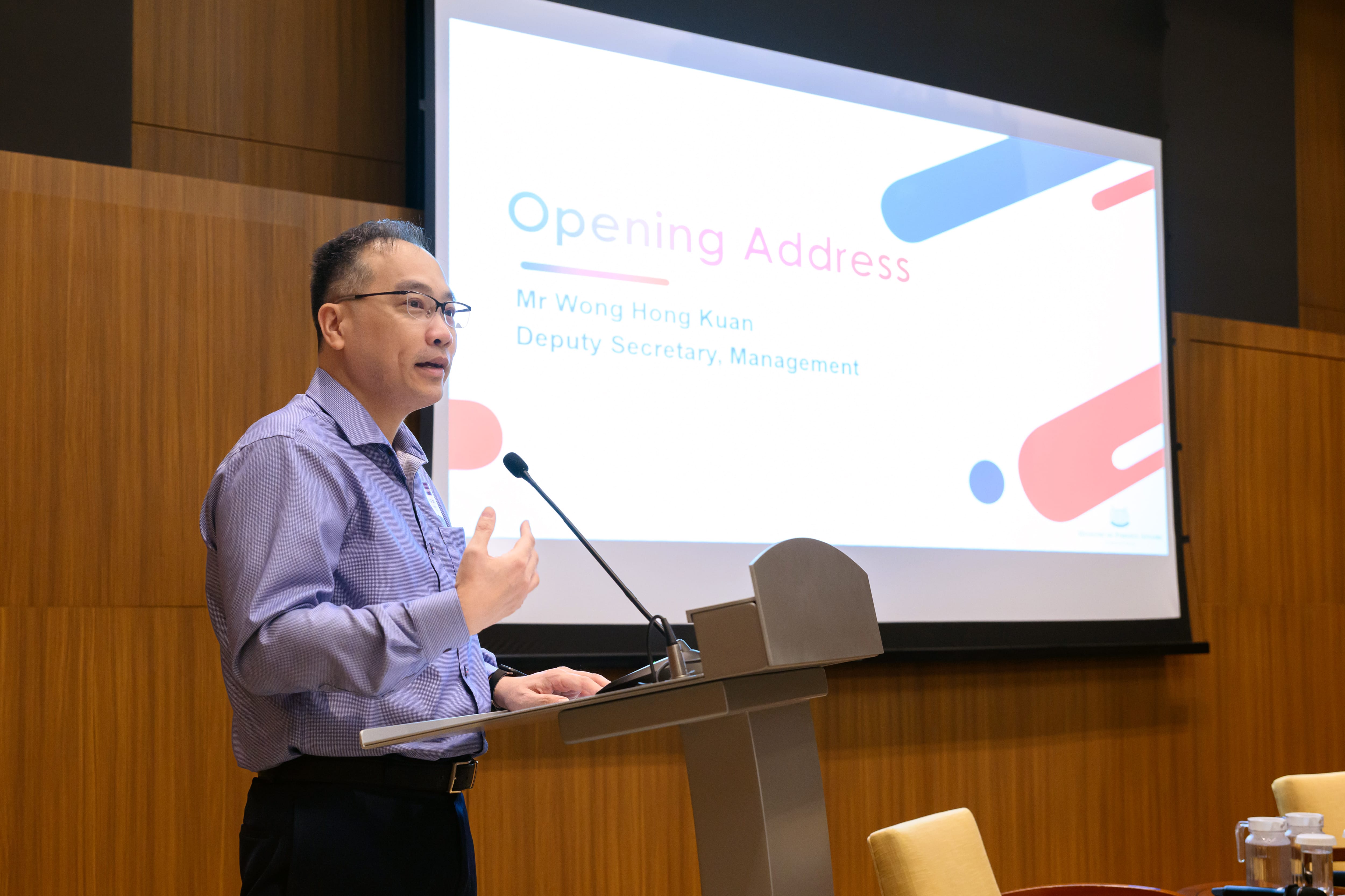 Speaker delivering opening address at an MFA event podium
