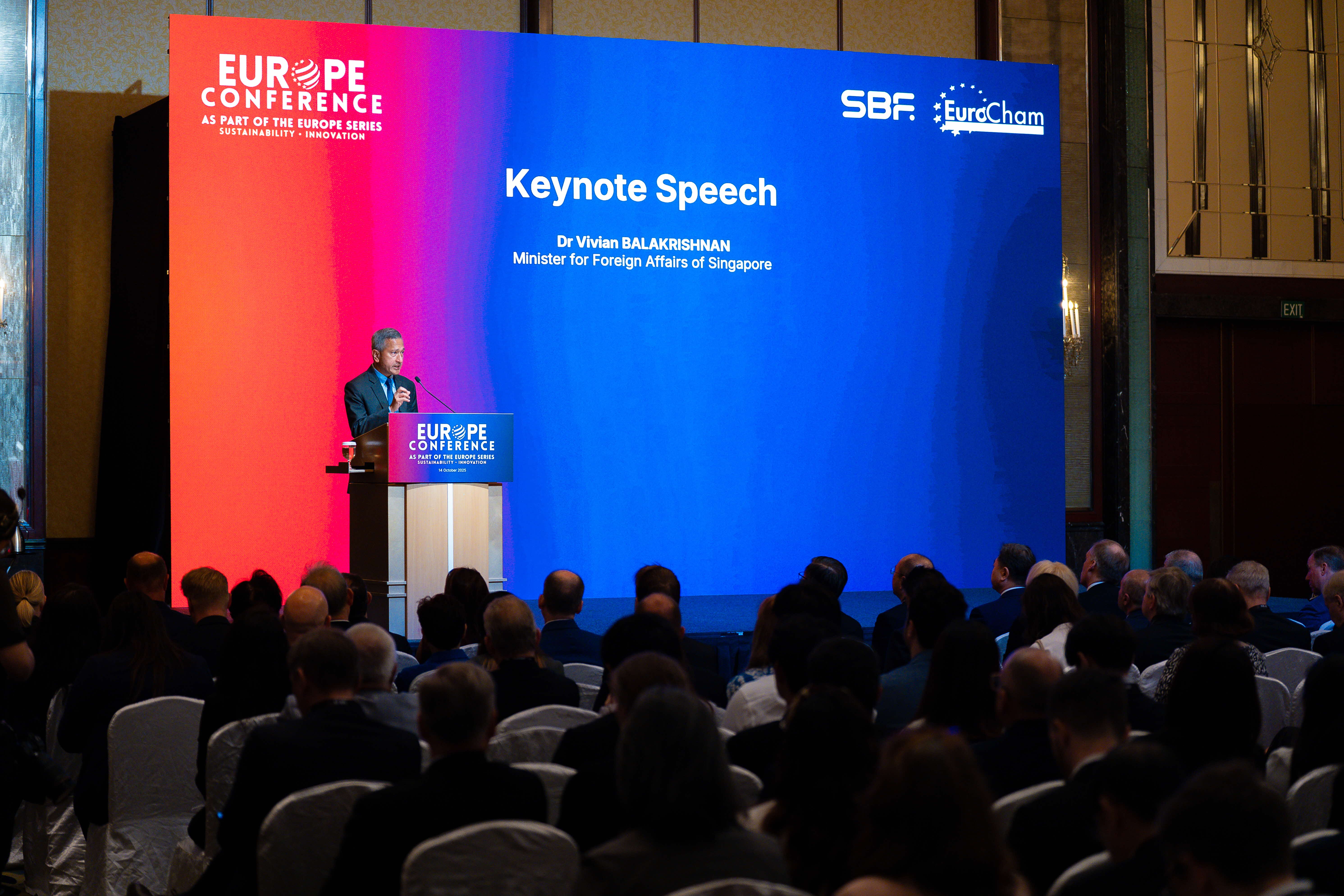 Audience watching Dr. Balakrishnan give a "Keynote Speech" at an SBF EuroCham "Europe Conference".