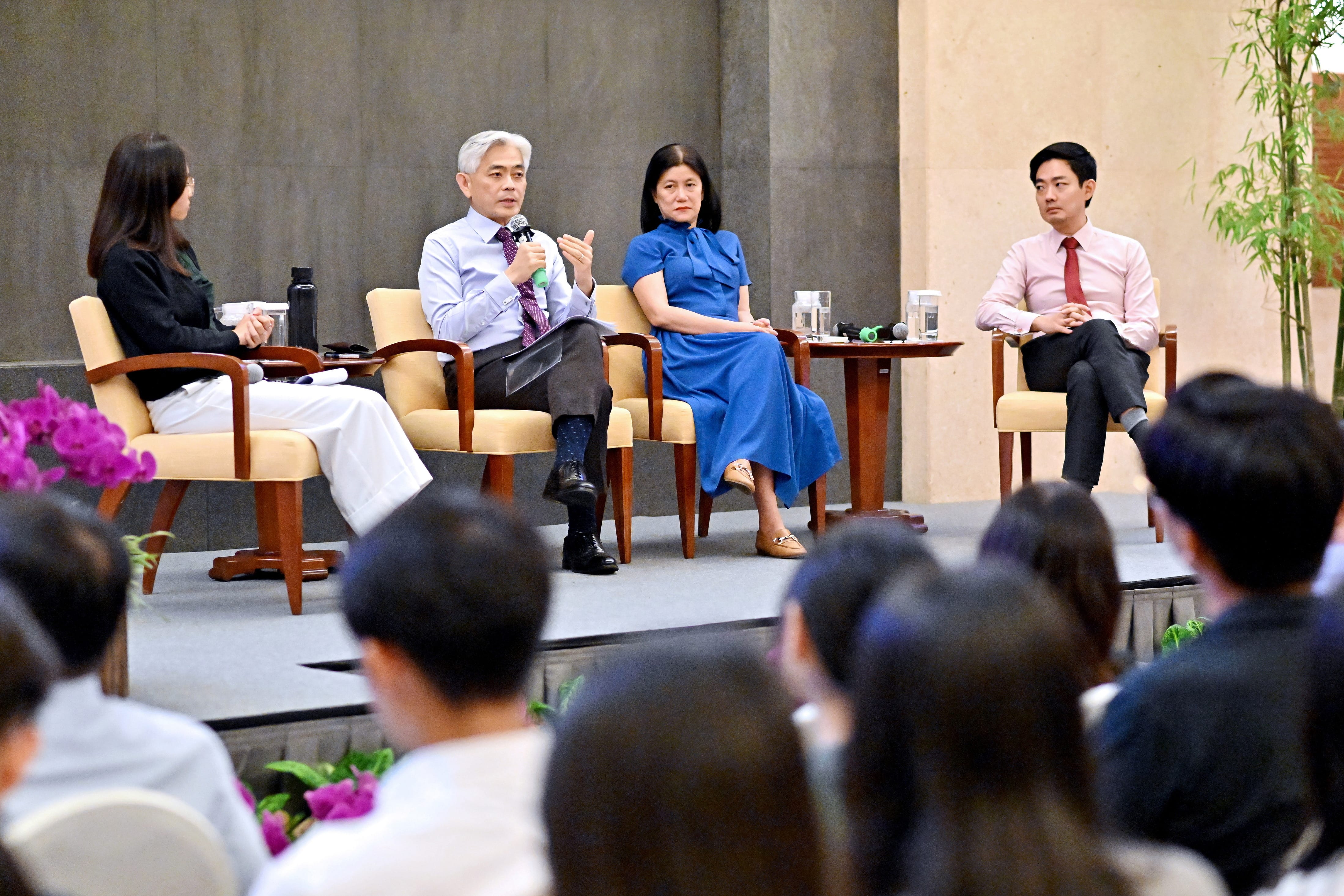 Panel of speakers seated on stage during the Foreign Service Scholarship session