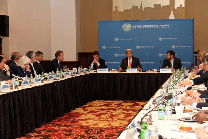 People at a conference table, with "Major Economies Forum on Energy and Climate" banner.