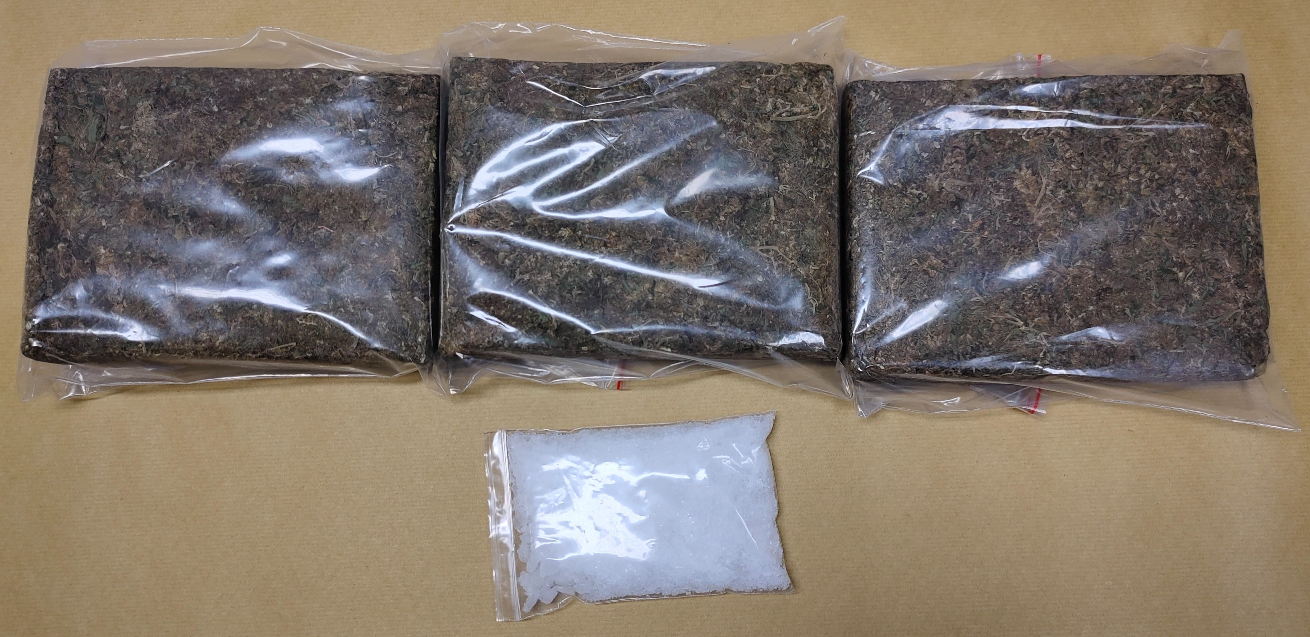 Three clear bags of dried plant material, a bag of white crystals.