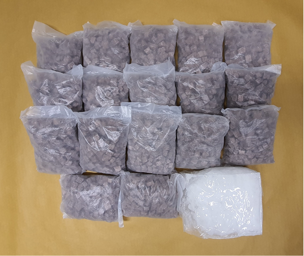 Collection of bladed weapons: katanas, knives, collapsible baton, and brass knuckles.