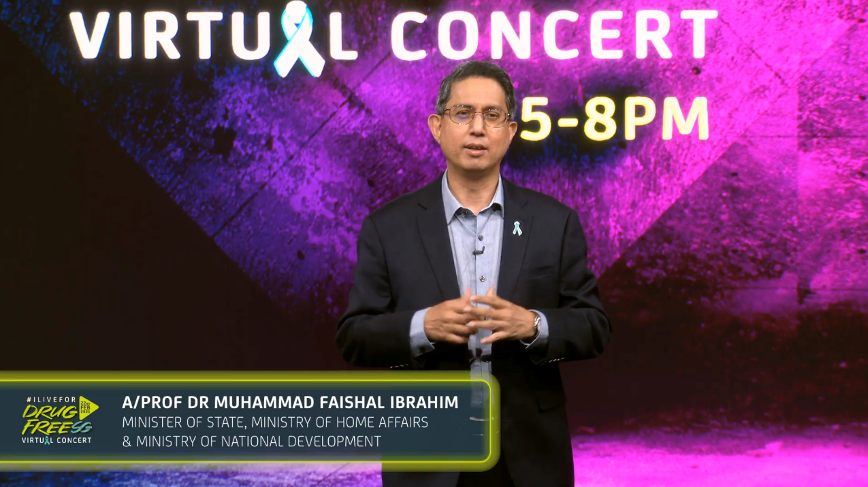 Man in suit on a "Virtual Concert" background, 5-8pm, blue ribbon logo.