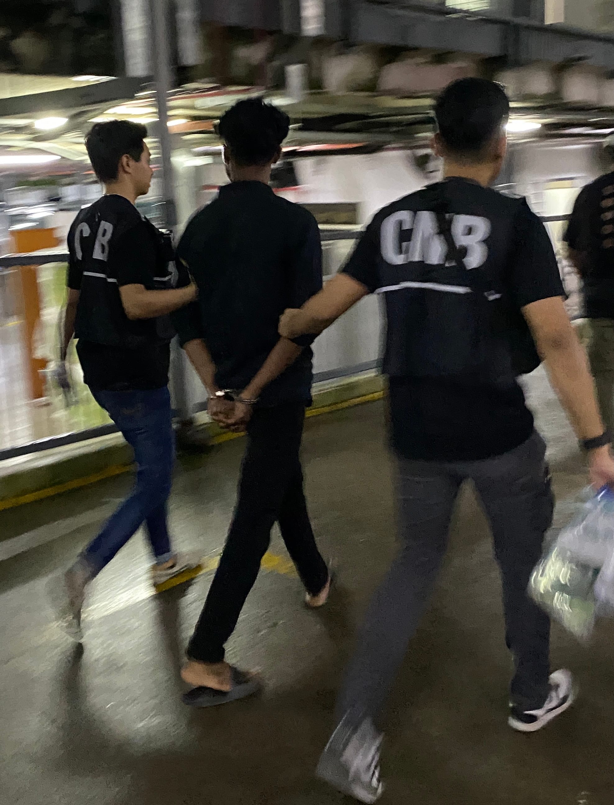 Suspected drug offenders arrested by CNB officers at a residential lodging in the vicinity of Woodlands in the early hours of 28 November 2025.